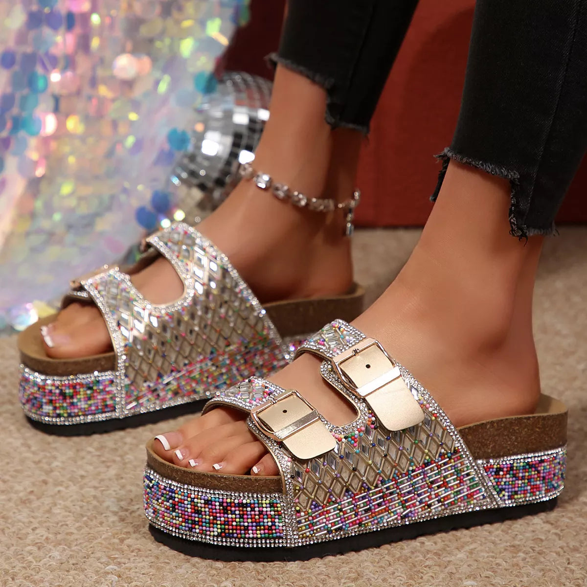 Silver-toned rhinestone sandals with double buckle straps and open-toe platform