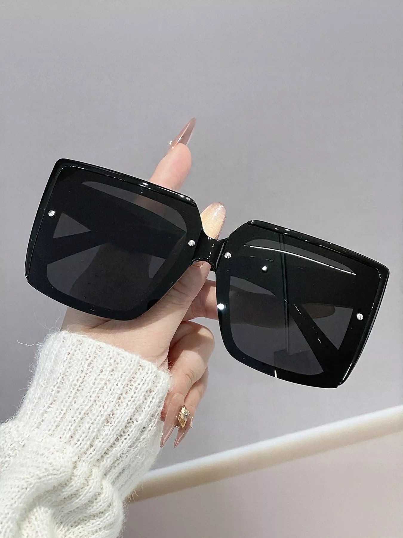 Black oversized square sunglasses, glossy frame with dark lenses