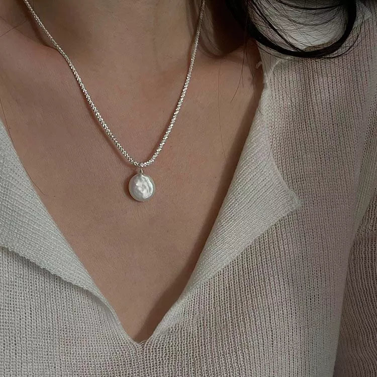 Silver chain with small round light pearl pendant