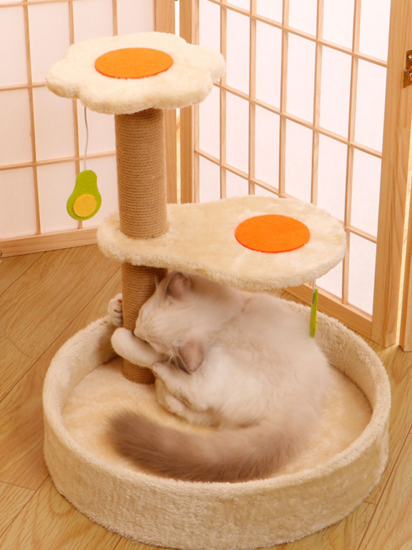Beige plush cat scratching set with orange circle pads and green leaf toy details