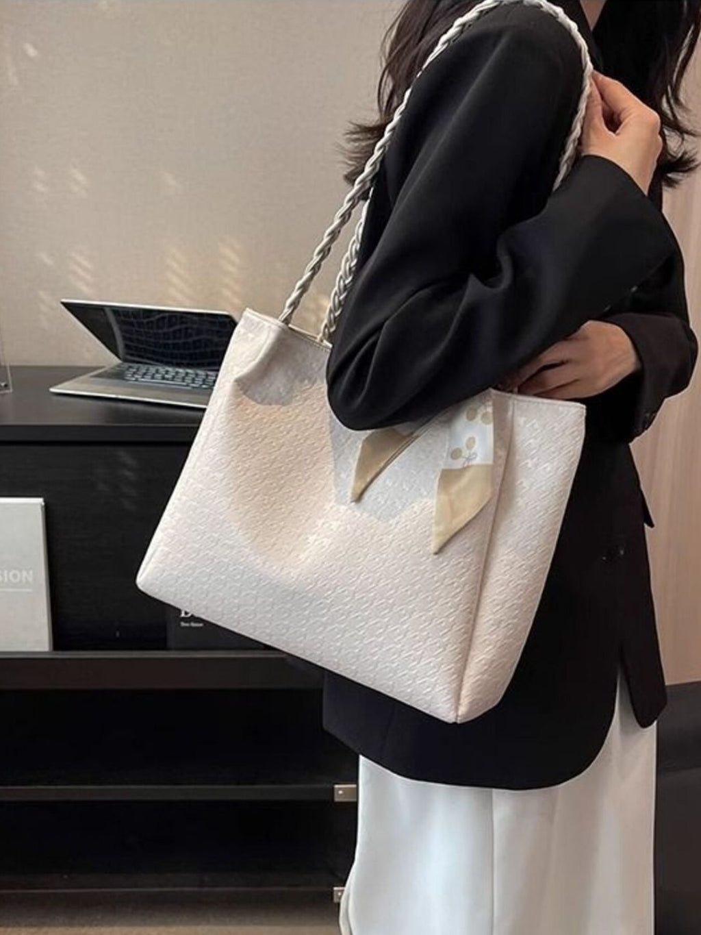 Braided handle tote bag in ivory, structured rectangular shape with bow at the handle