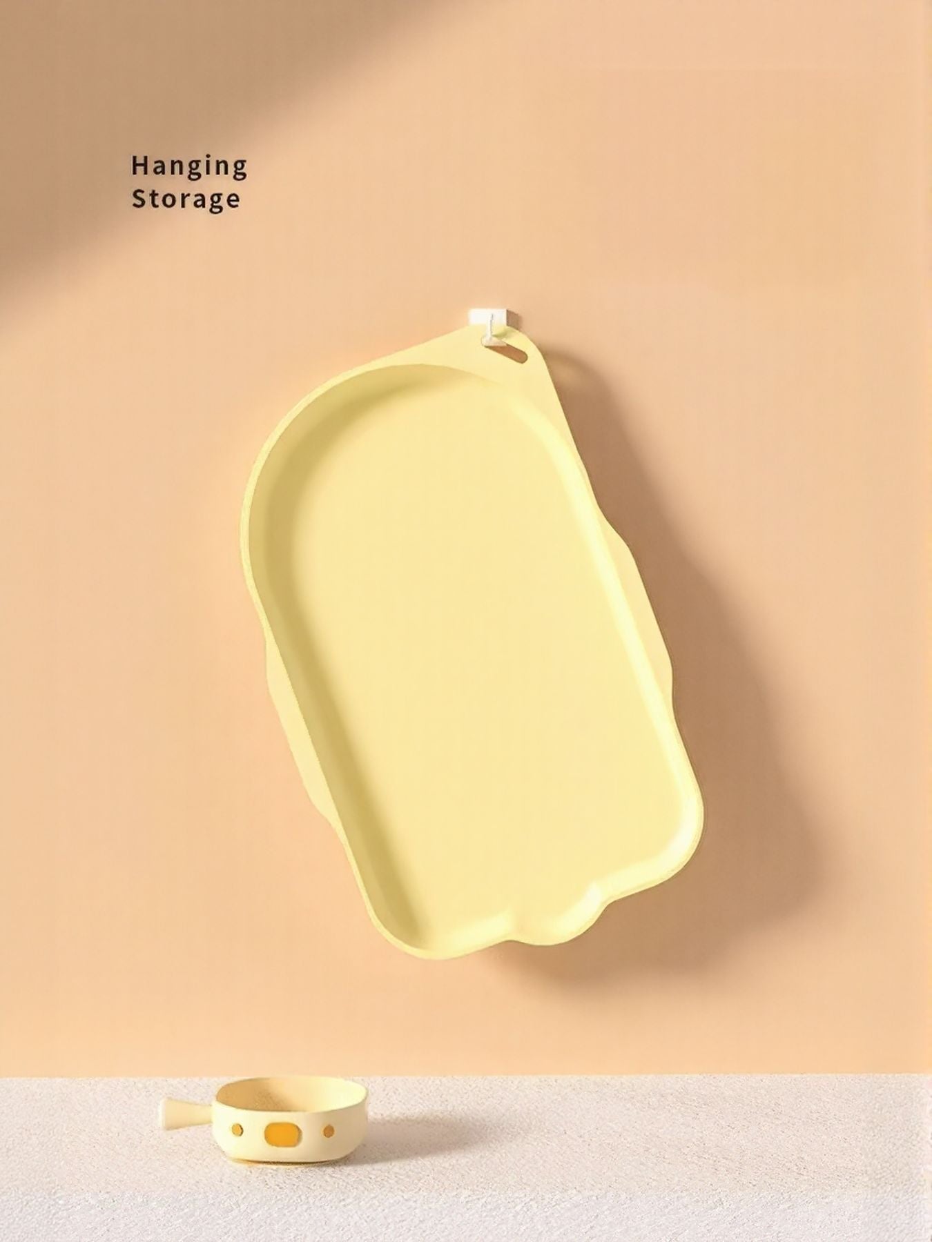 Hanging storage pet bowl tray in pastel yellow, wall hook attachment