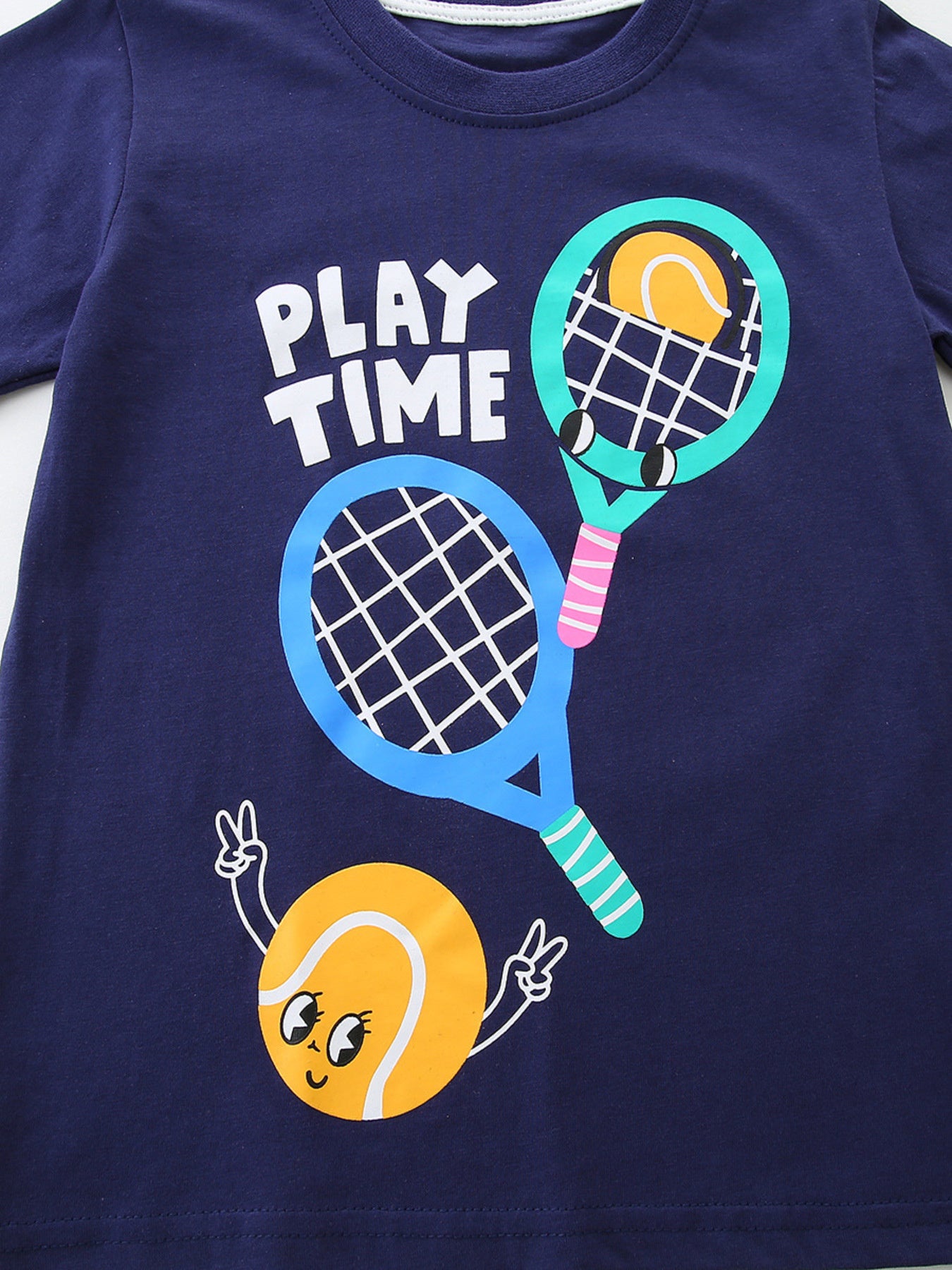 Dark navy kids crew-neck T-shirt tennis-themed illustration with striped racket sleeve
