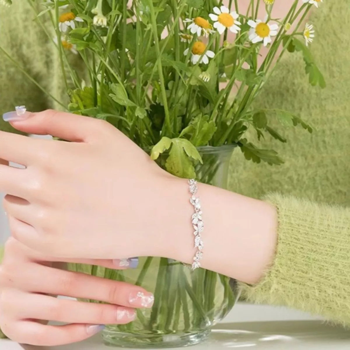 925 Sterling Silver zircon wisteria bracelet on wrist, silver-toned stones