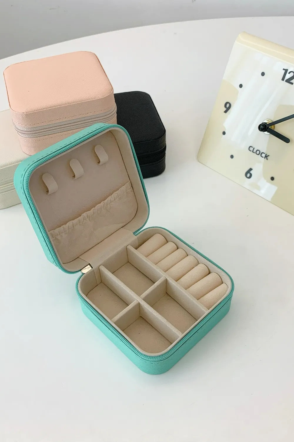 Turquoise PU leather square jewelry box open showing ring compartments