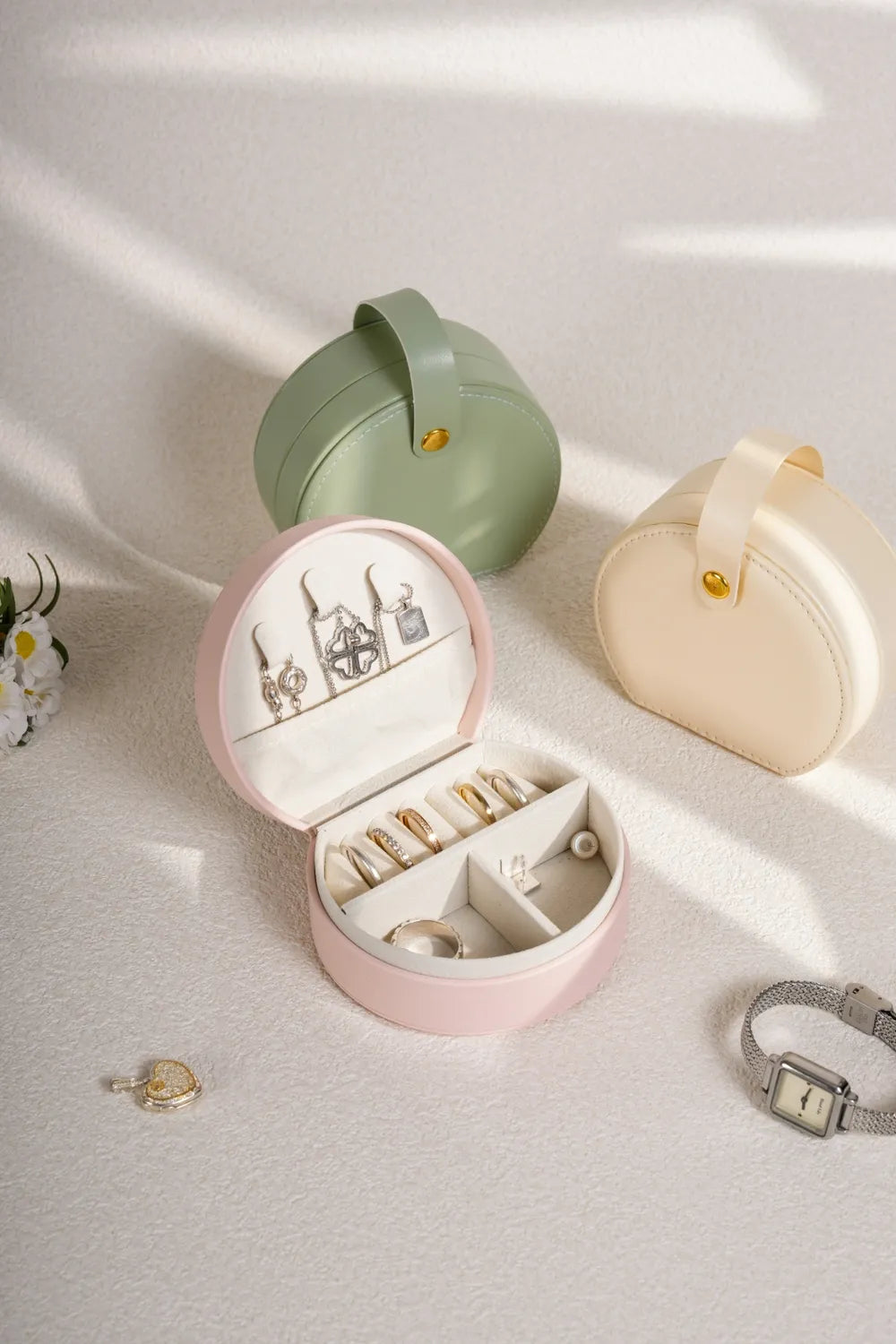 Blush pink PU leather travel jewelry box open with necklace and ring compartments
