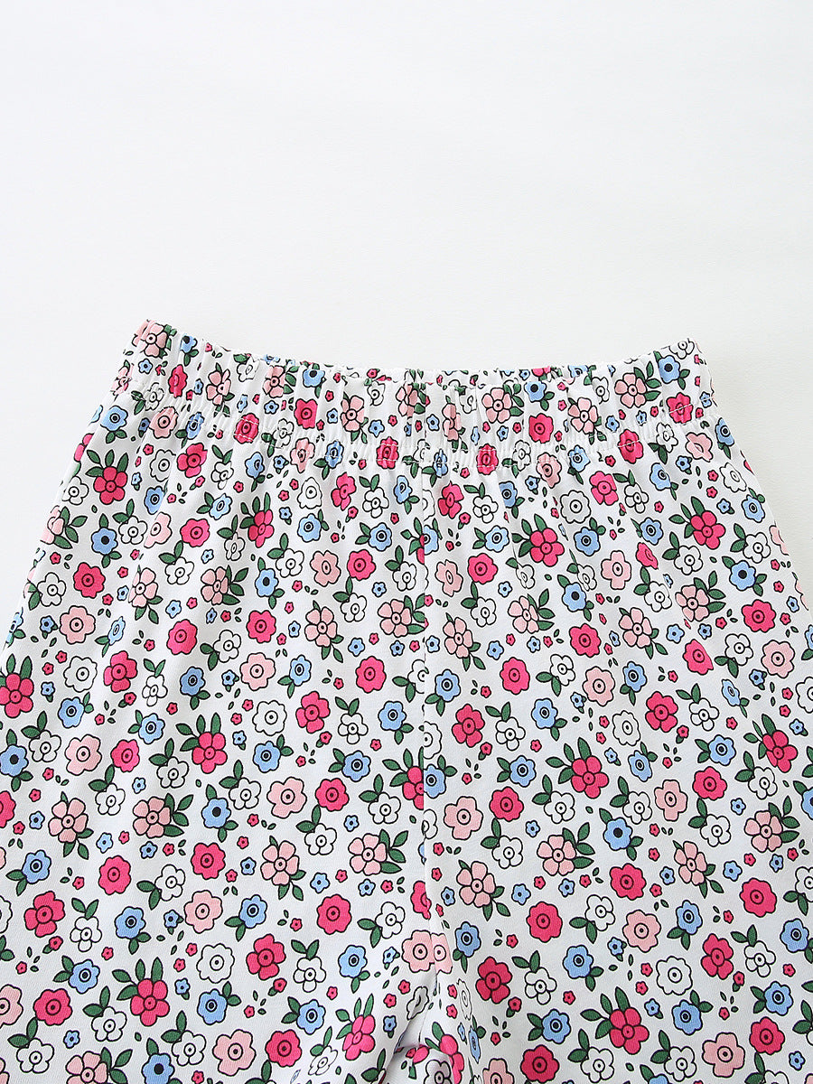 Floral shorts with elastic waist, white with pink, blue, and green flower print