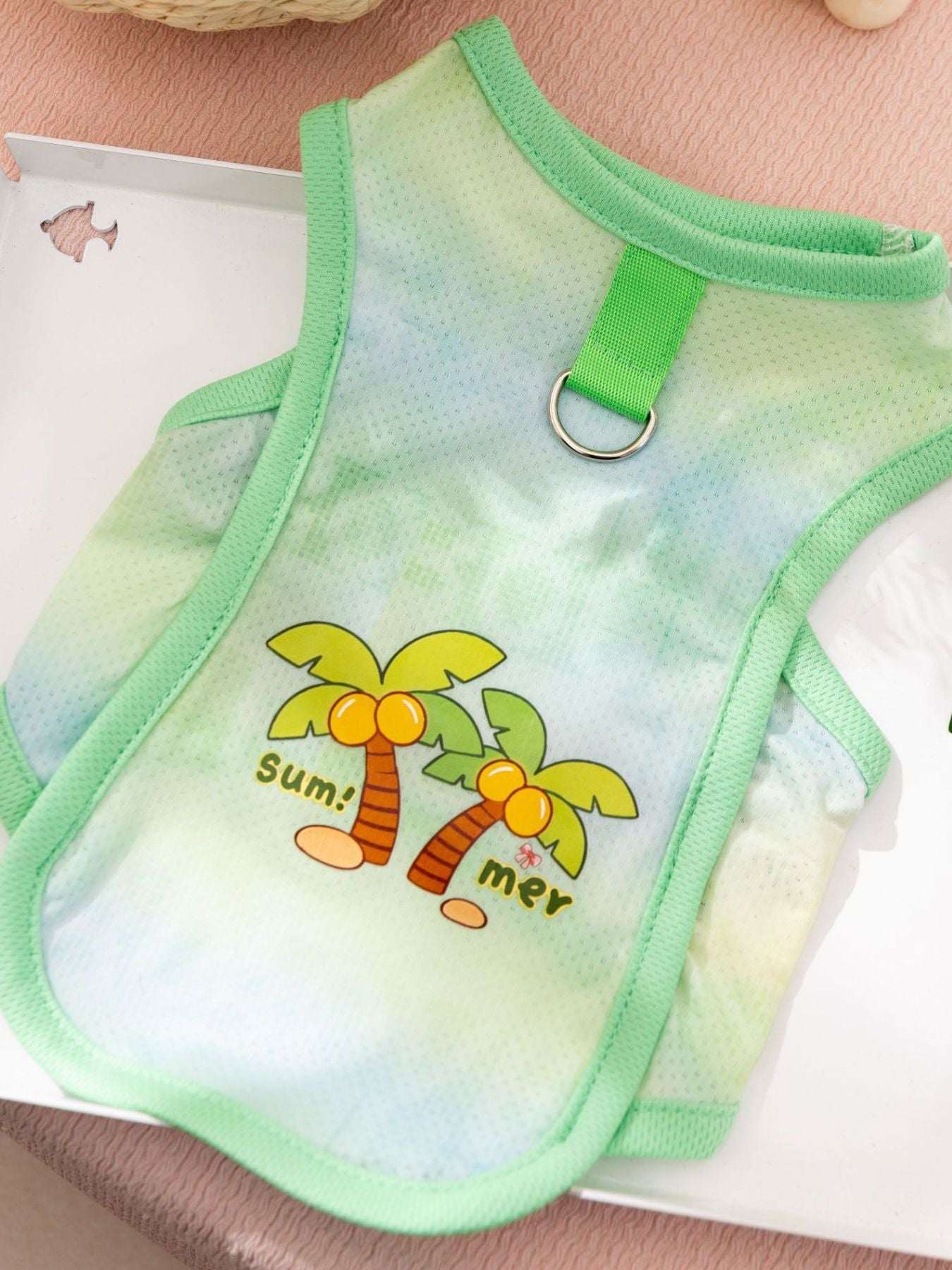 Green pet tank with “sun! mer!” palm tree graphic and metal collar ring