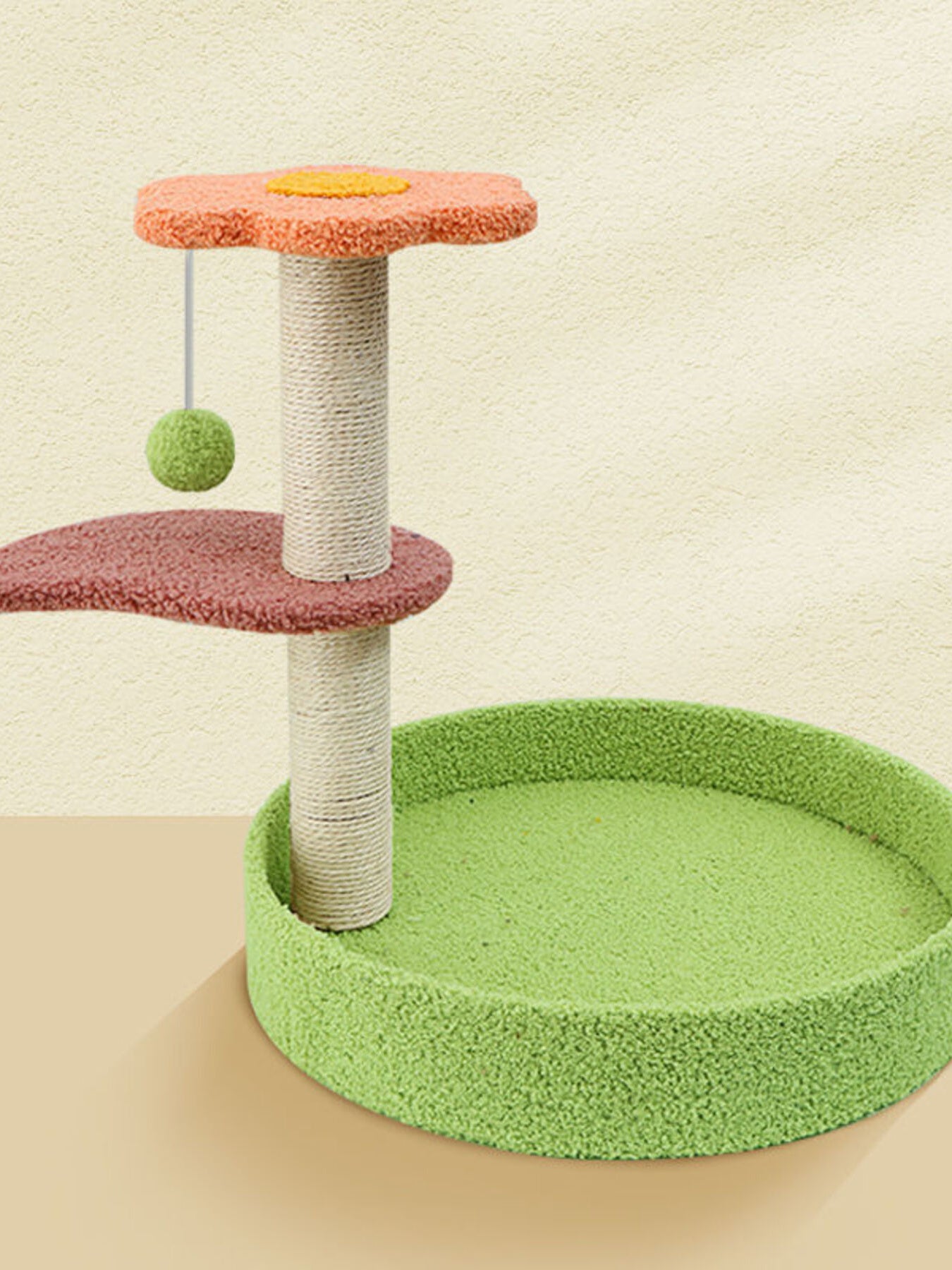 Green cat scratching post with rope poles, round green mat and orange top platform