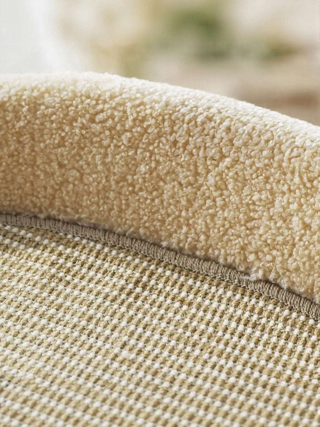 Tan plush edge and woven sisal scratching pad close-up on cat scratching bed