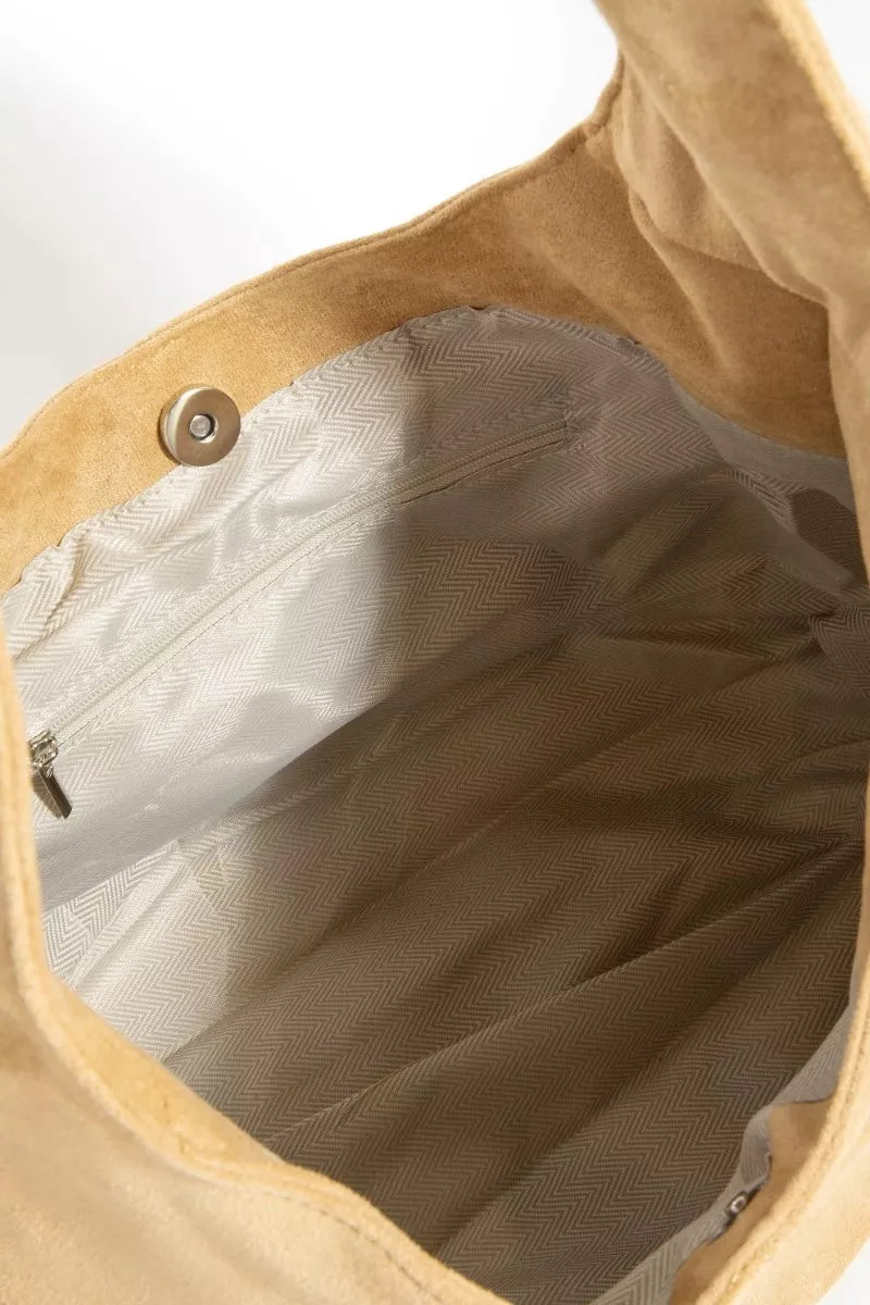 Hobo bag interior lining with chevron pattern and snap button pocket