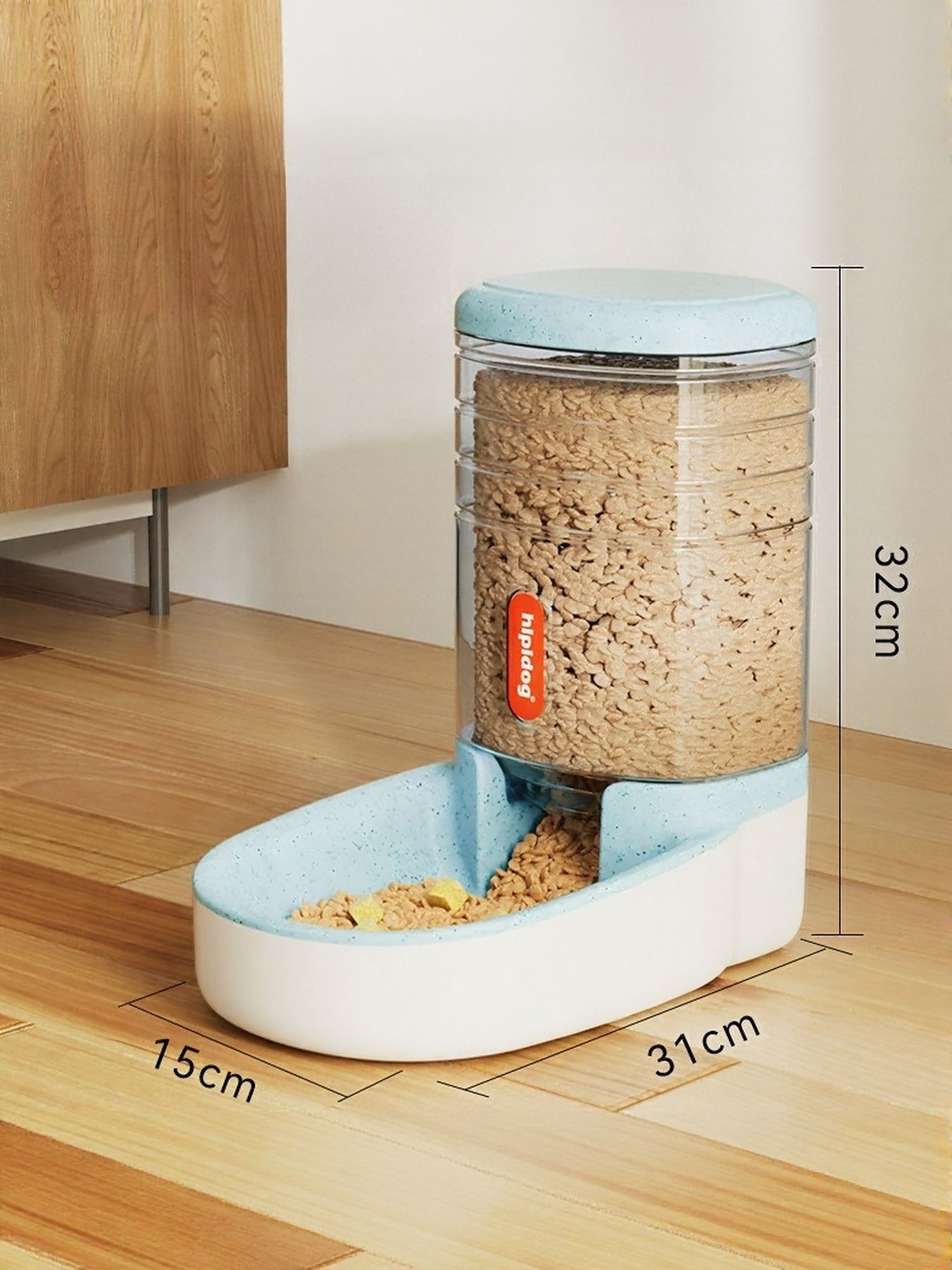 Light blue automatic pet food dispenser with clear container and blue-tinted feed tray