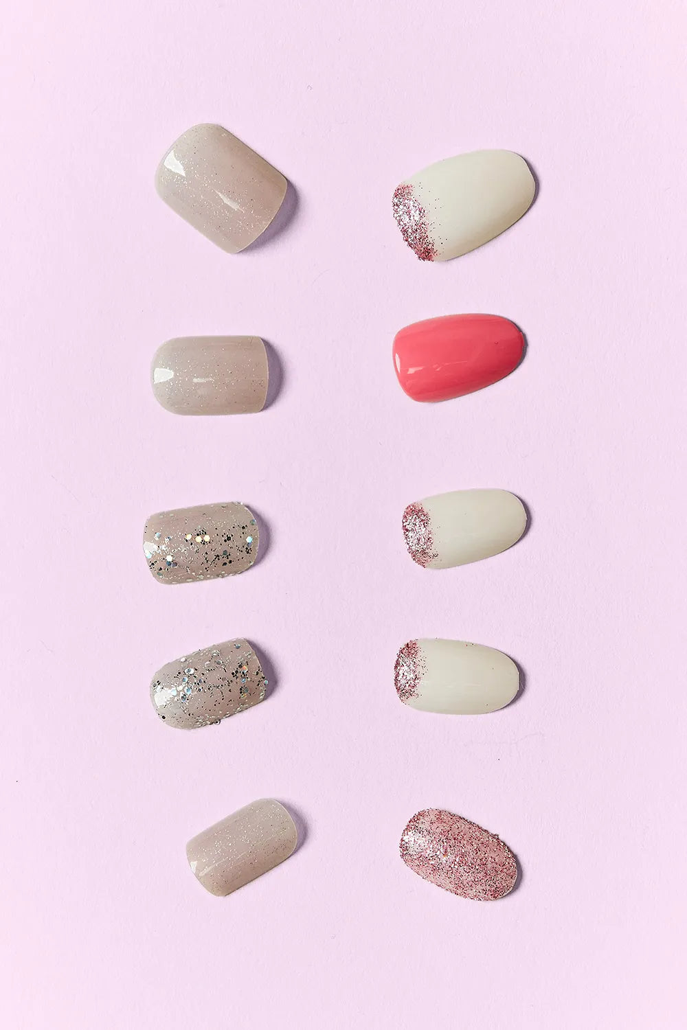 Pop of Pink press-on nails: beige, glitter, coral red, and speckled sparkle tips