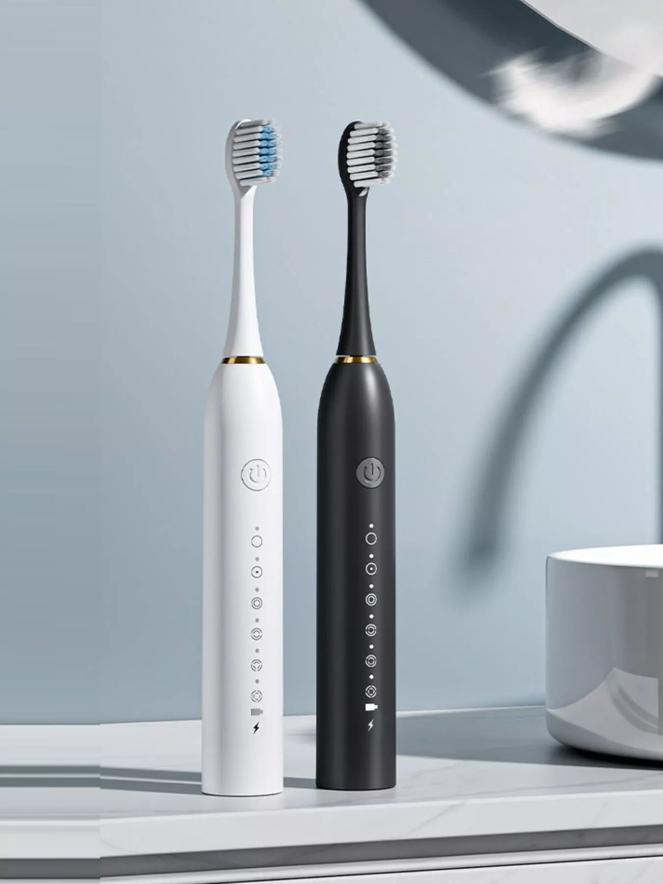 Electric toothbrushes: white and black handles with multi-mode buttons