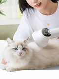 Low Noise Pet Hair Dryer & Comb, white dryer warming a cat with blue eyes