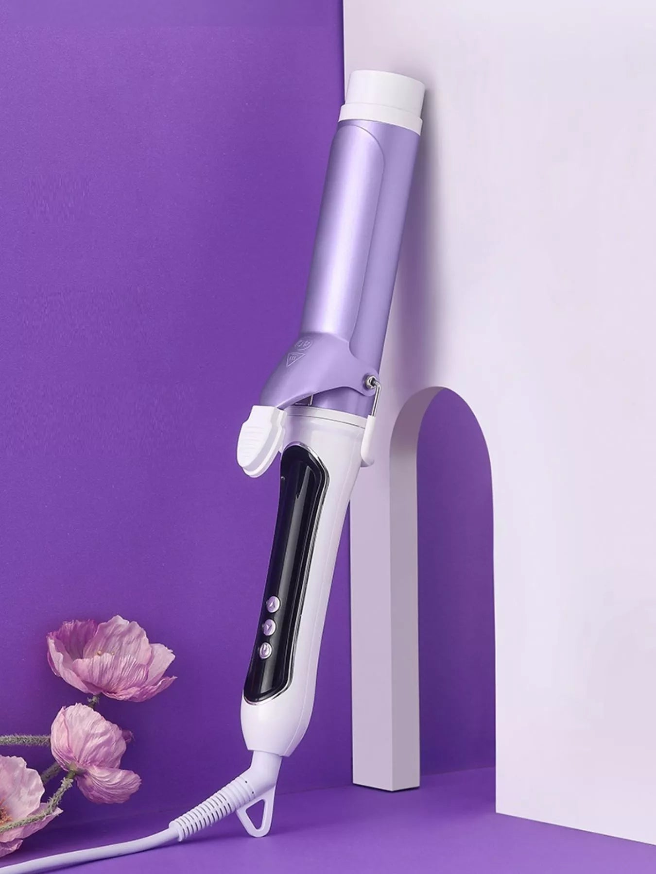 Purple automatic rotating ceramic curling iron with white heat guard and buttons.