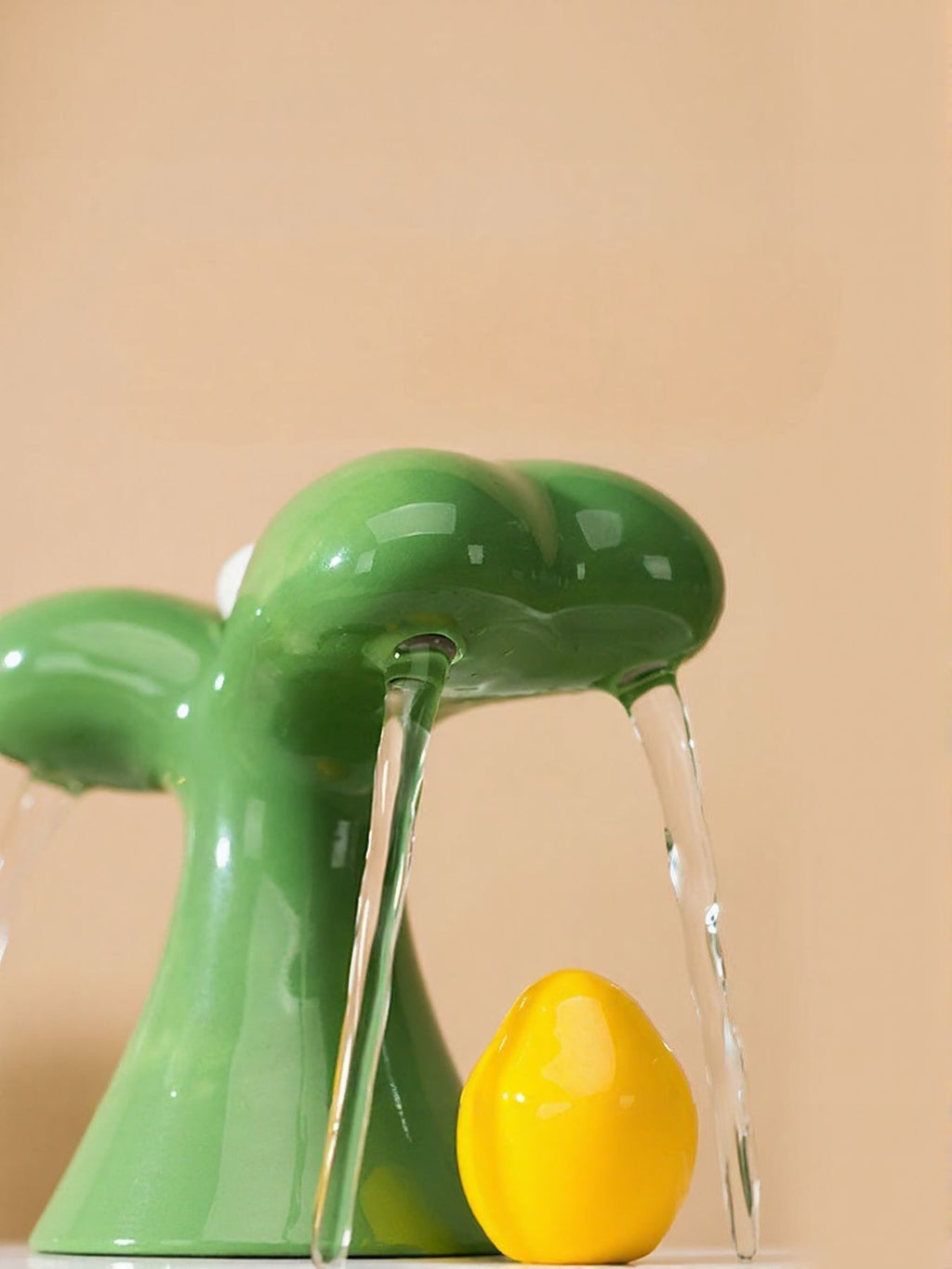 Matcha green pet drinking fountain with green spout and yellow water outlet