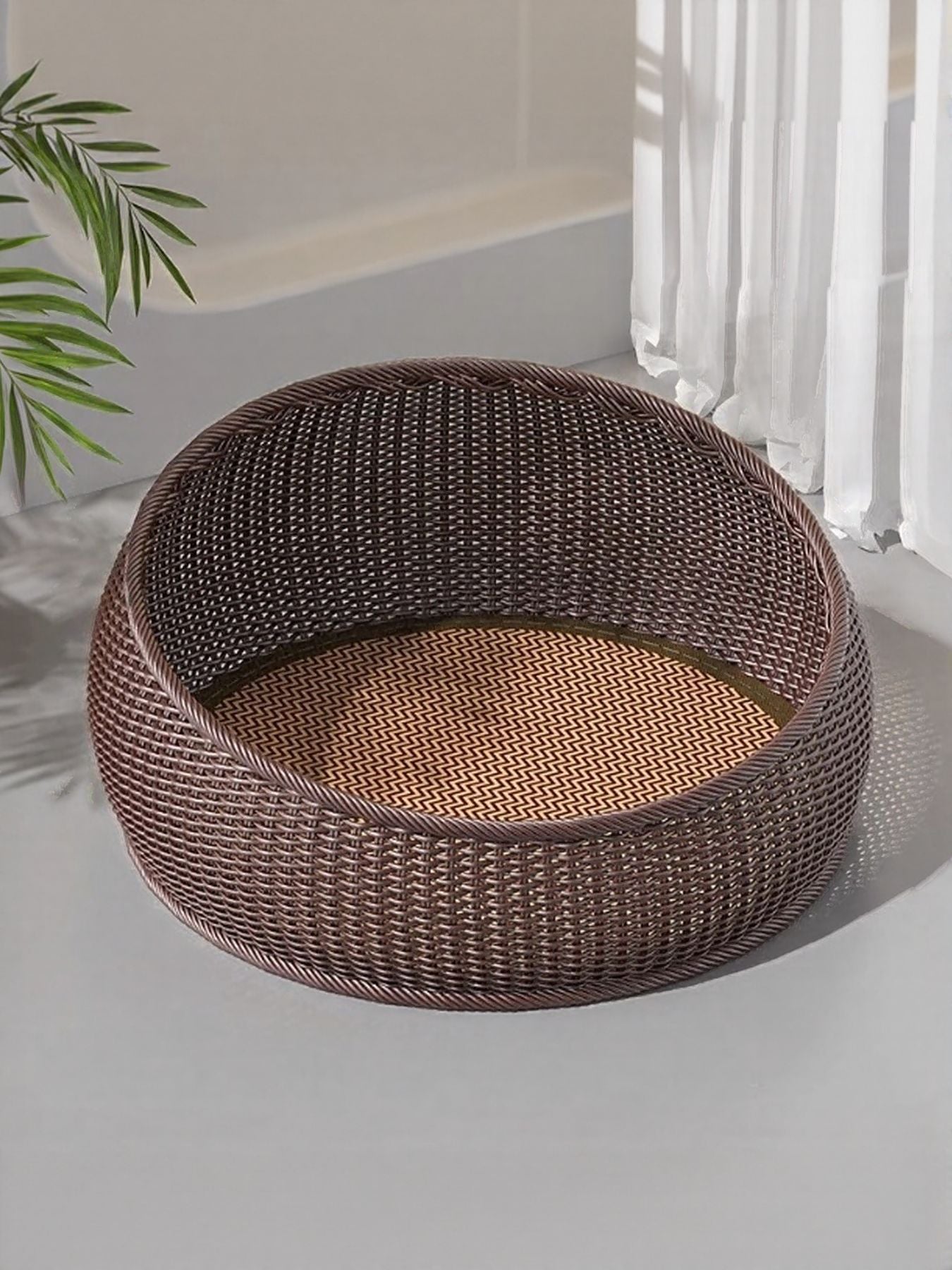 Brown round woven rattan pet nest with zigzag cushion insert