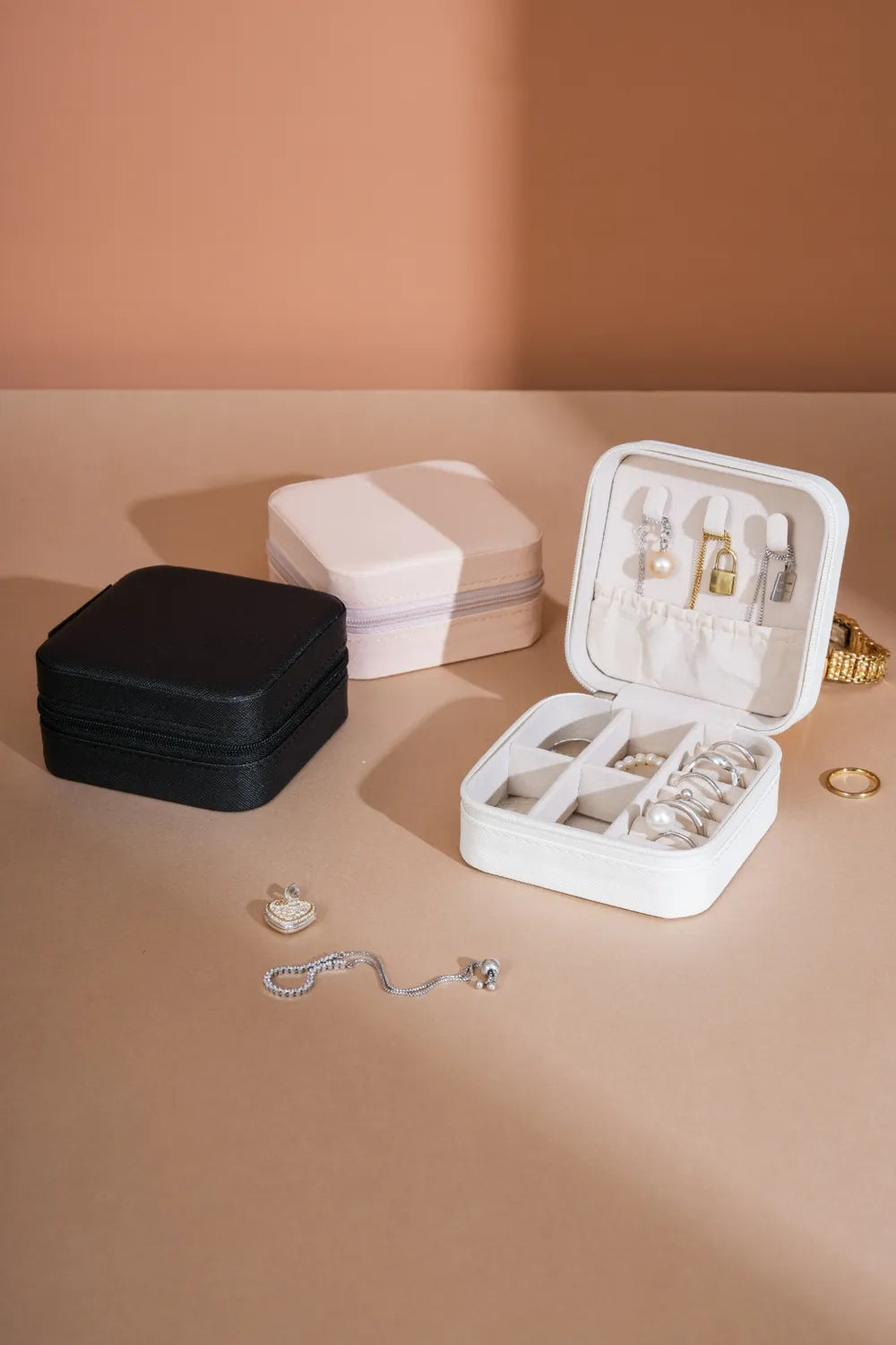 White PU leather square jewelry box, open lid with ring, earring, and necklace slots
