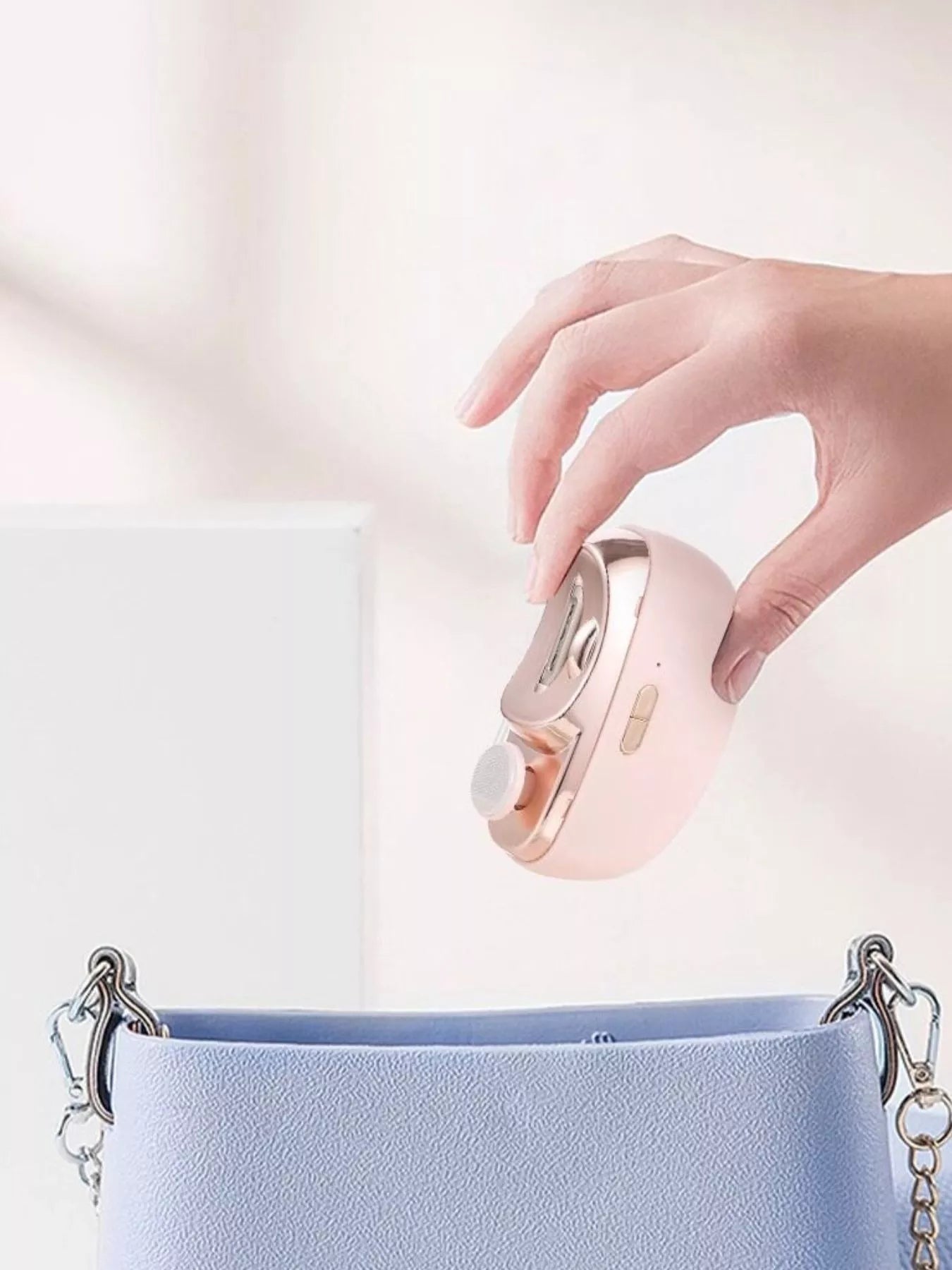 Blush pink electric nail buffer handheld with thumb controller