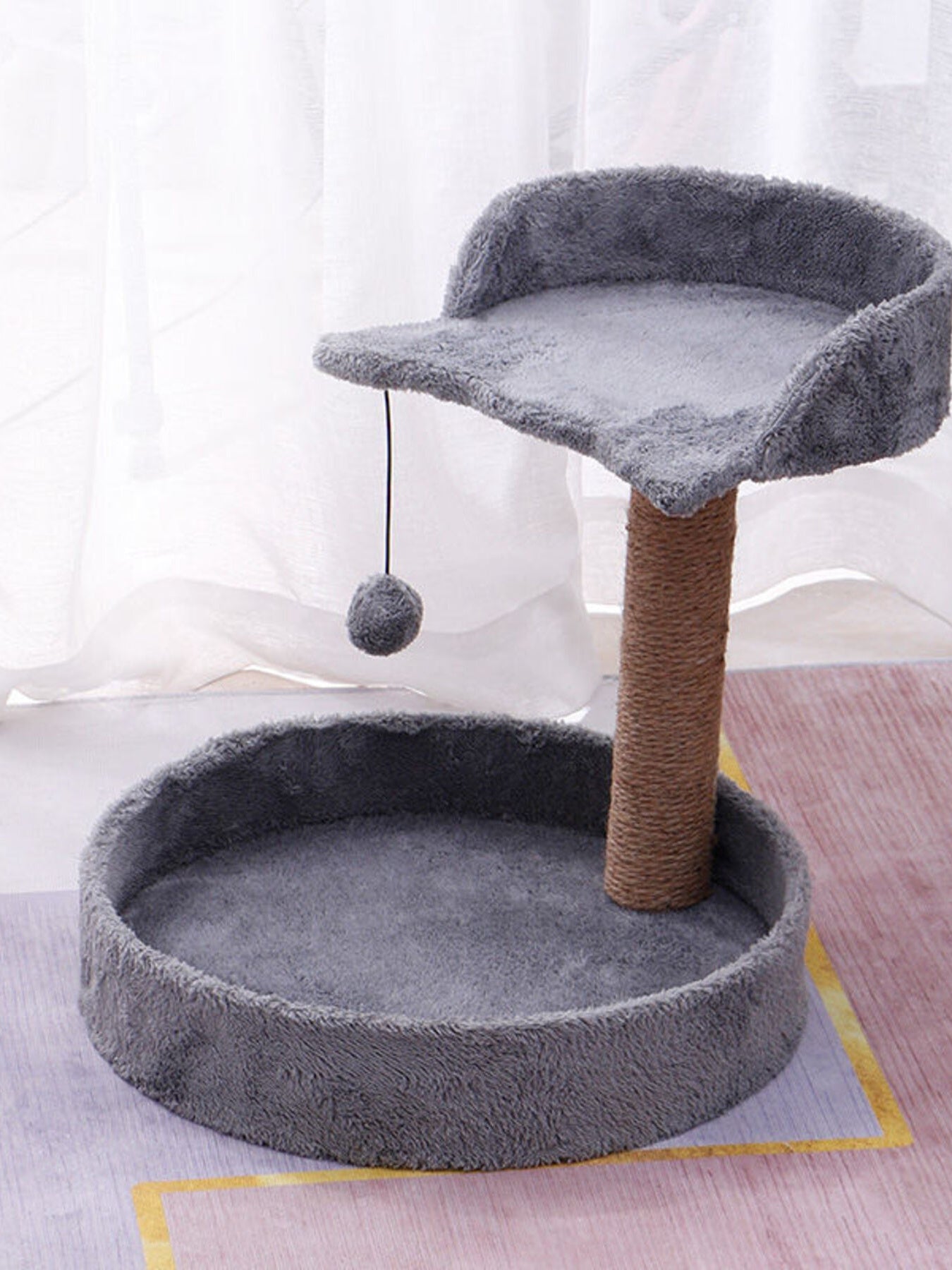 Dark gray cat scratching post with two fuzzy platforms, plush bed and dangling ball toy
