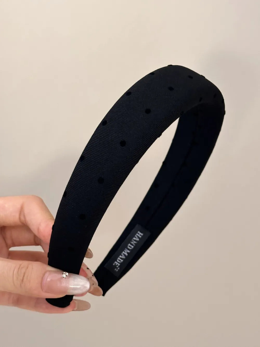 Black polka dot wide polyester headband with subtle black dots