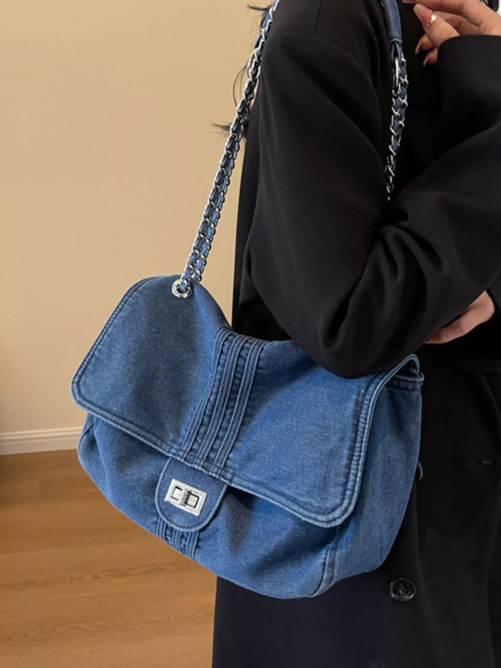 Blue denim flap chain shoulder bag with metal clasp and silver chain strap