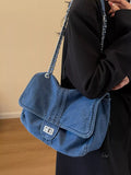 Blue denim flap chain shoulder bag with metal clasp and silver chain strap