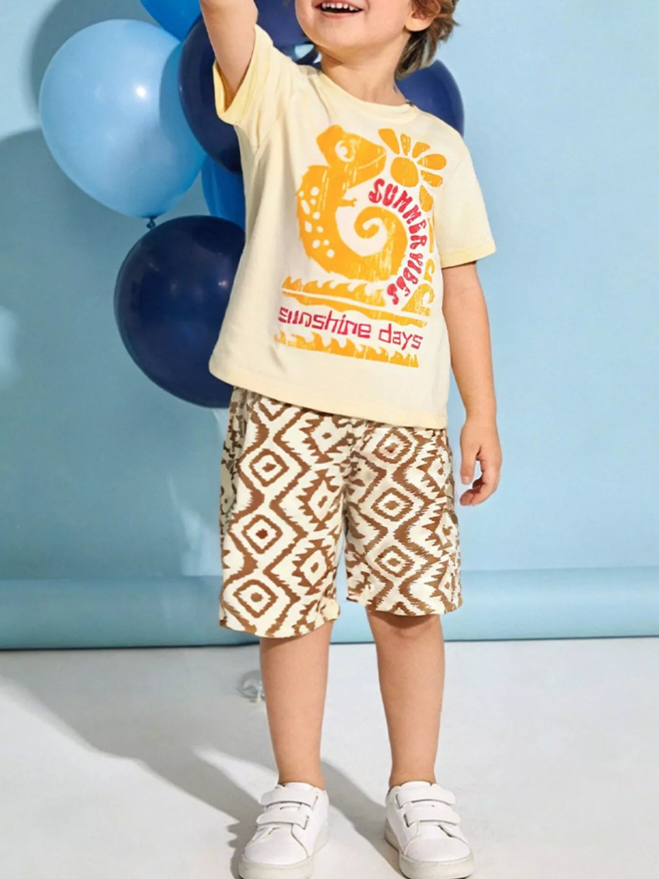 Pastel Yellow kids graphic tee and geometric print shorts set