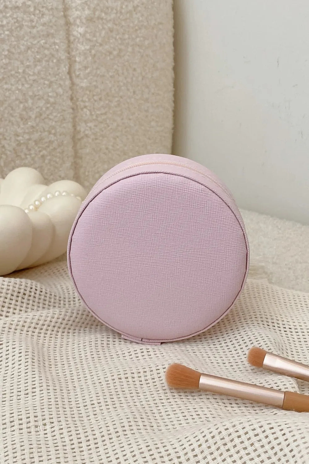Blush pink round PU leather jewelry storage box, closed