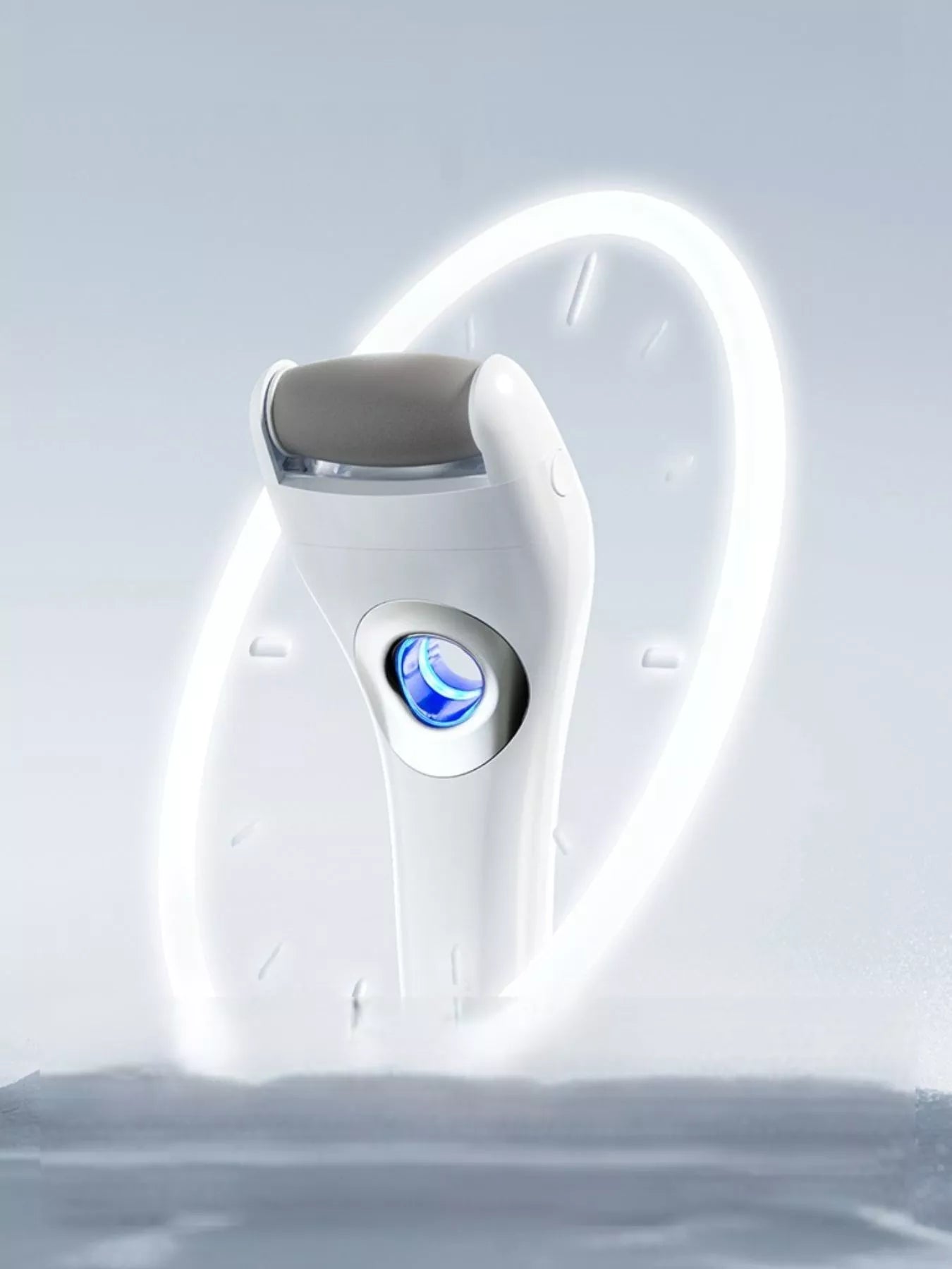 White electric foot nail buffer shown from above with bright blue LED glow