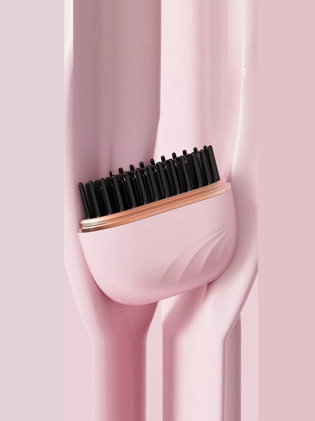 Portable hair straightening comb in blush pink with black heated teeth