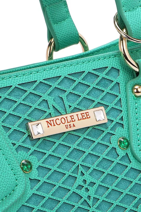 Teal-green monogram handbag front plate with rhinestone accents and logo tag