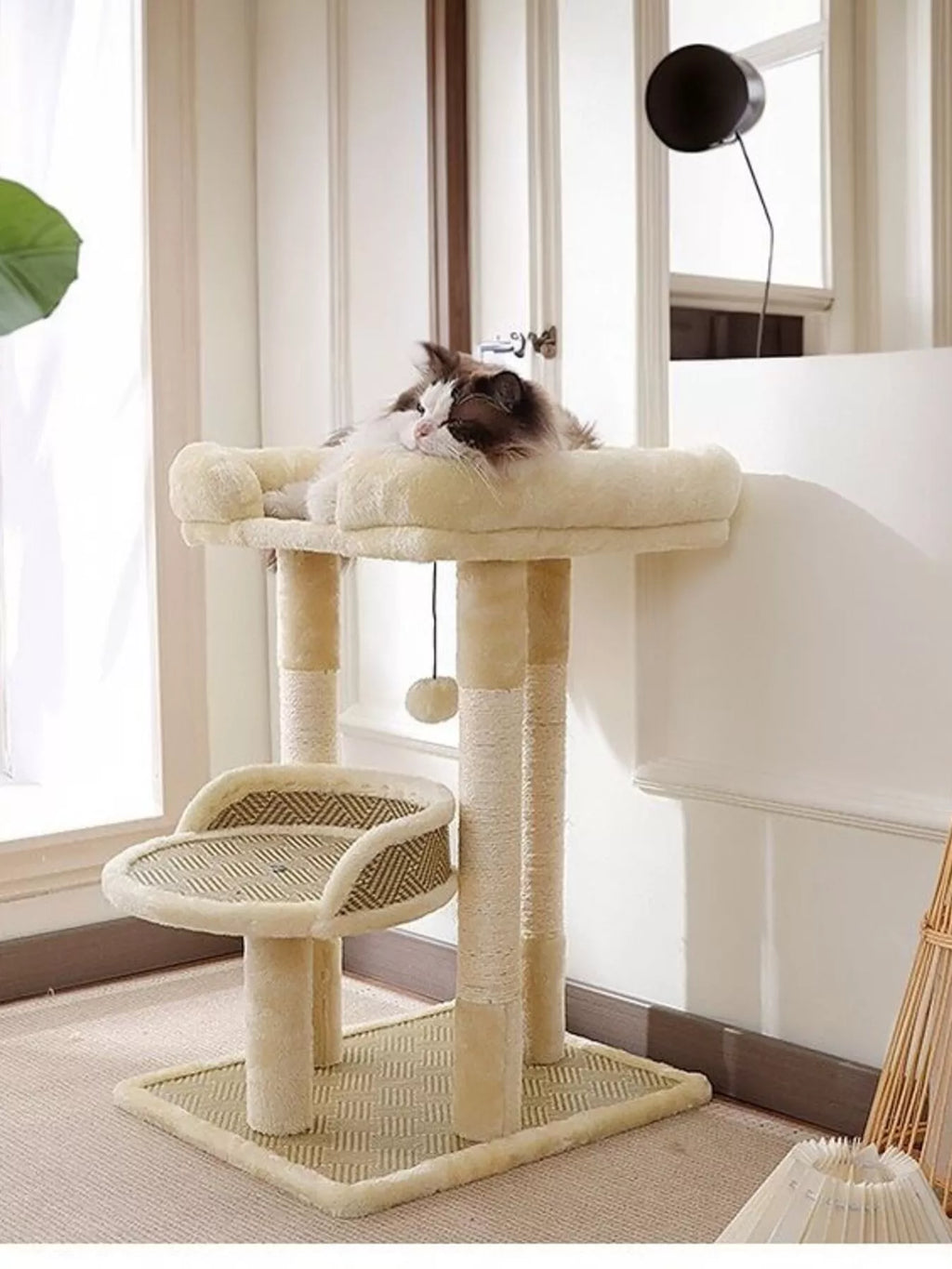 Cream plush cat tree condo with side perch and lower sisal platform; dangling ball