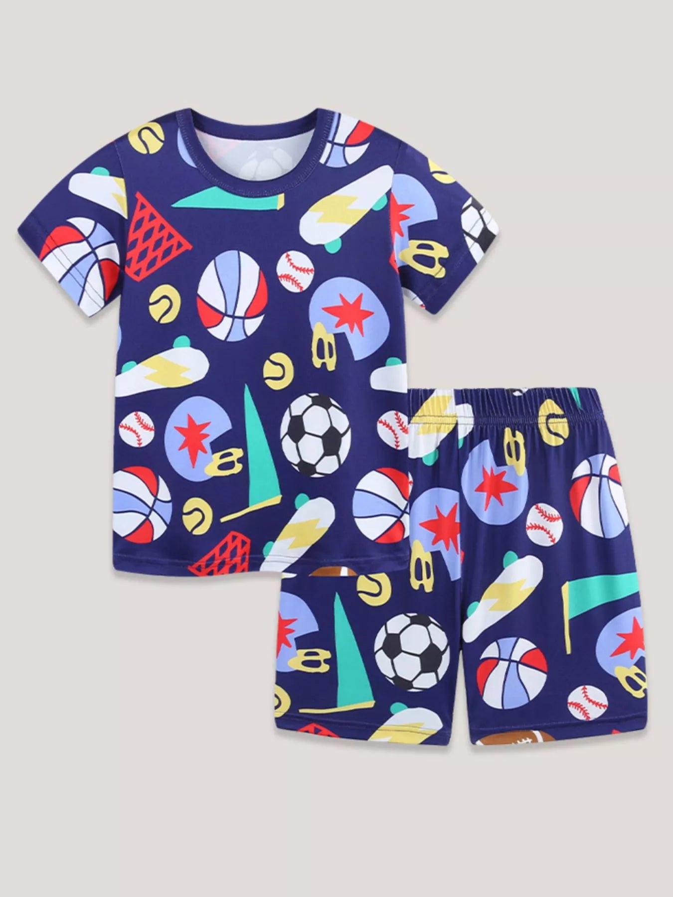 Flat lay kids sports tee and shorts set in navy with multicolor graphic print