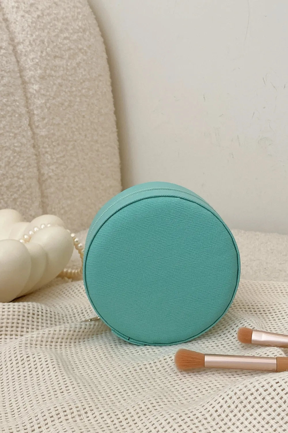 Turquoise round PU leather jewelry storage box with zipper, closed