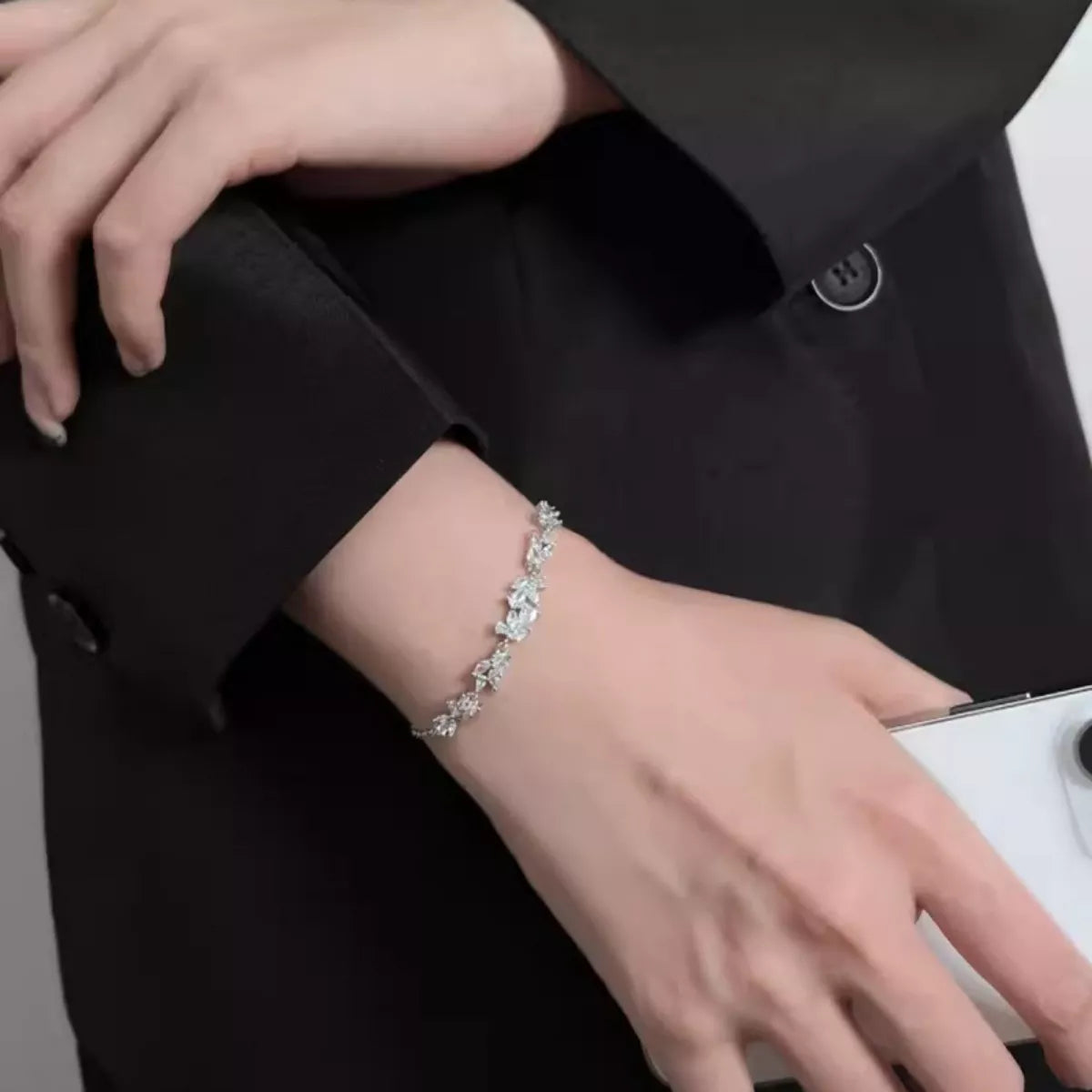 Zircon wisteria silver bracelet on wrist, repeating marquise stone links