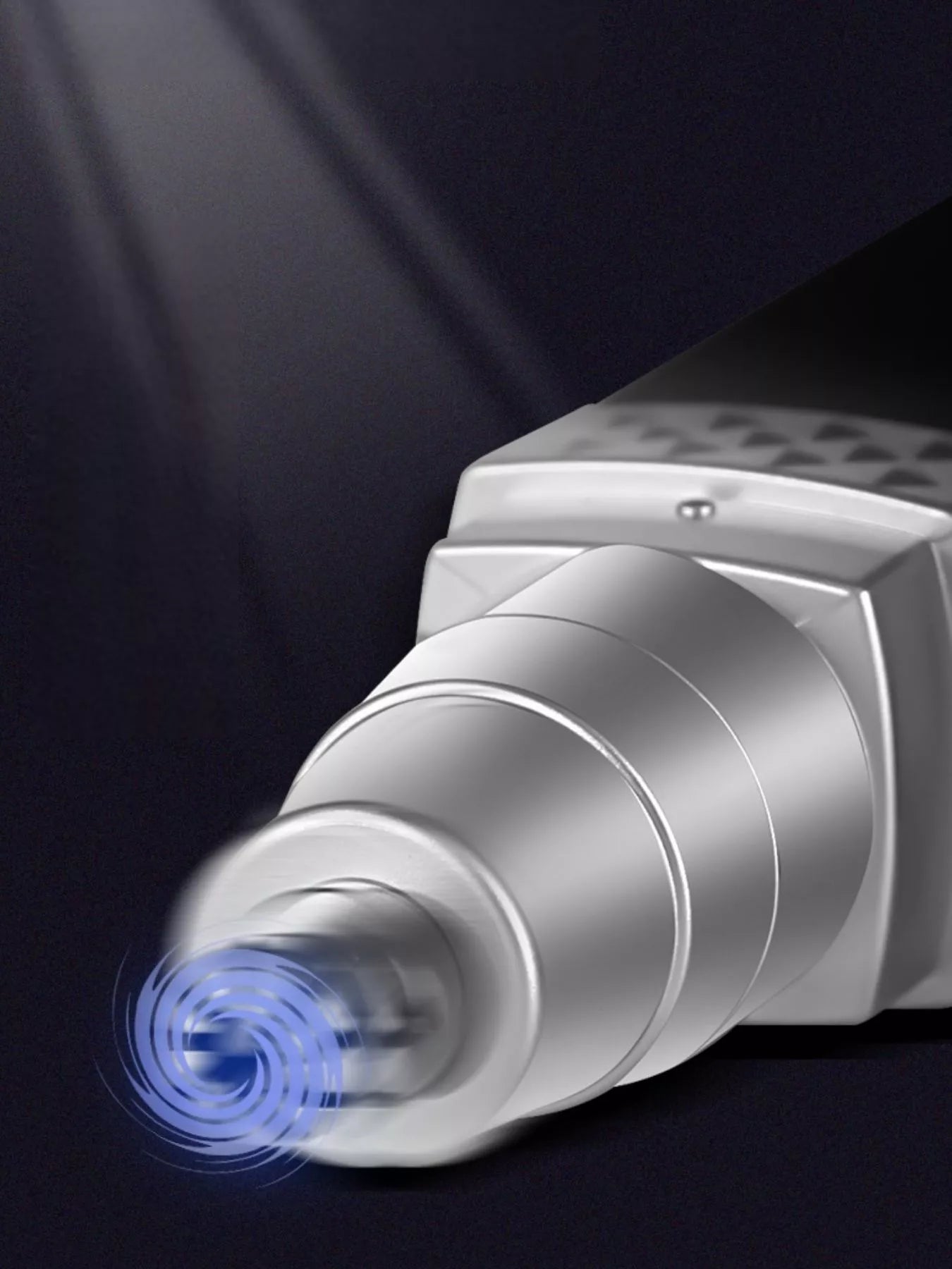 Close-up of white/silver nose hair trimmer nozzle and patterned front panel