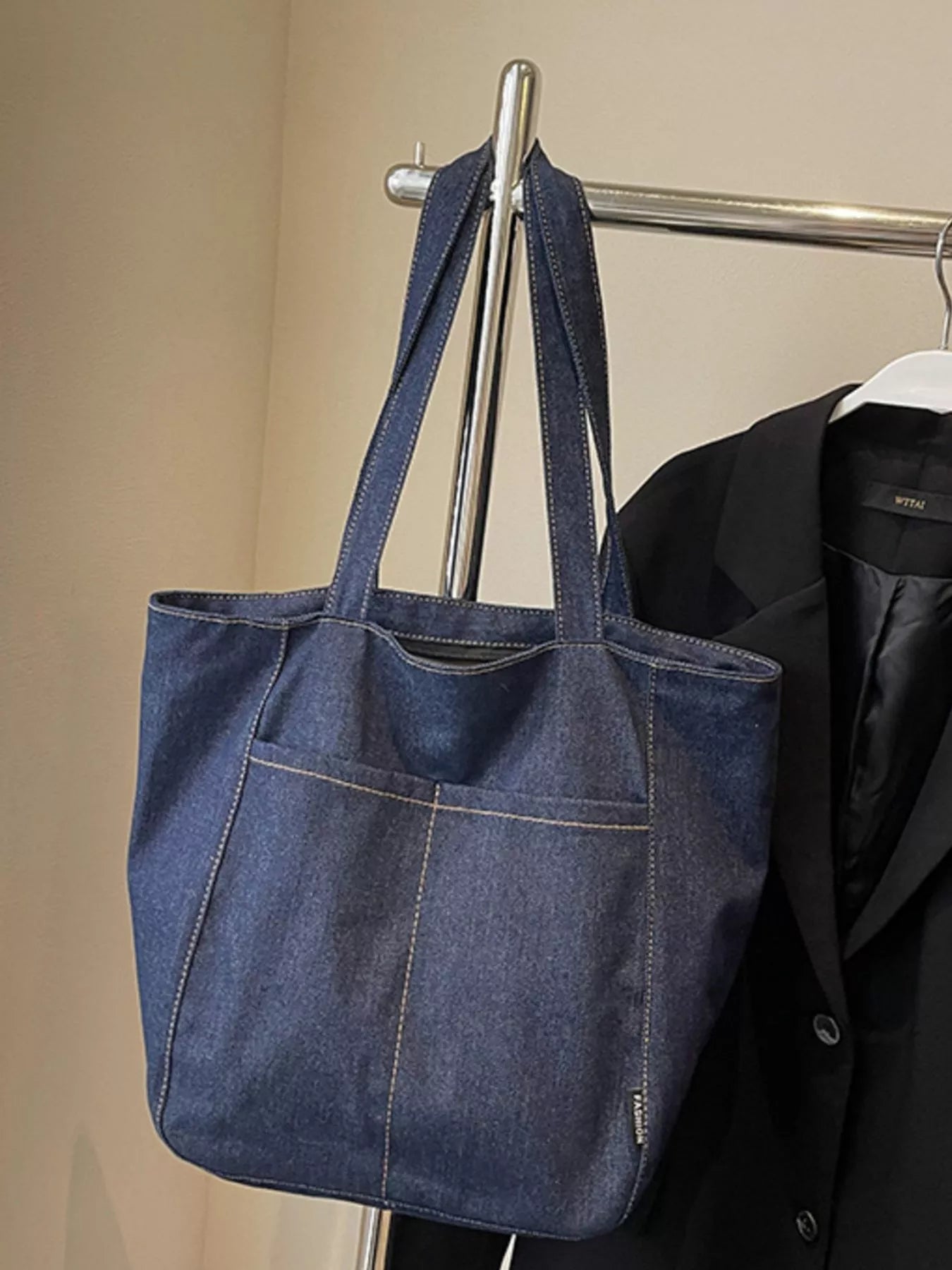 Navy denim tote bag with twin handles and stitched front panel