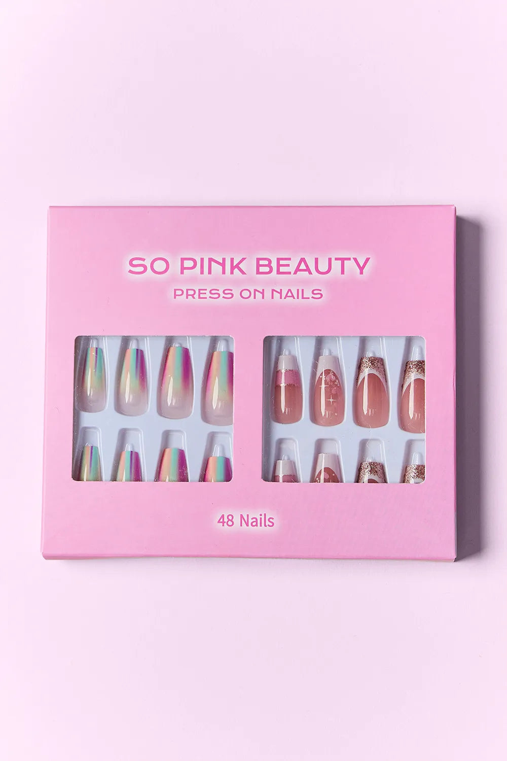 Press-on nails box with 48 nails, pale nude tips with rainbow foil and stars