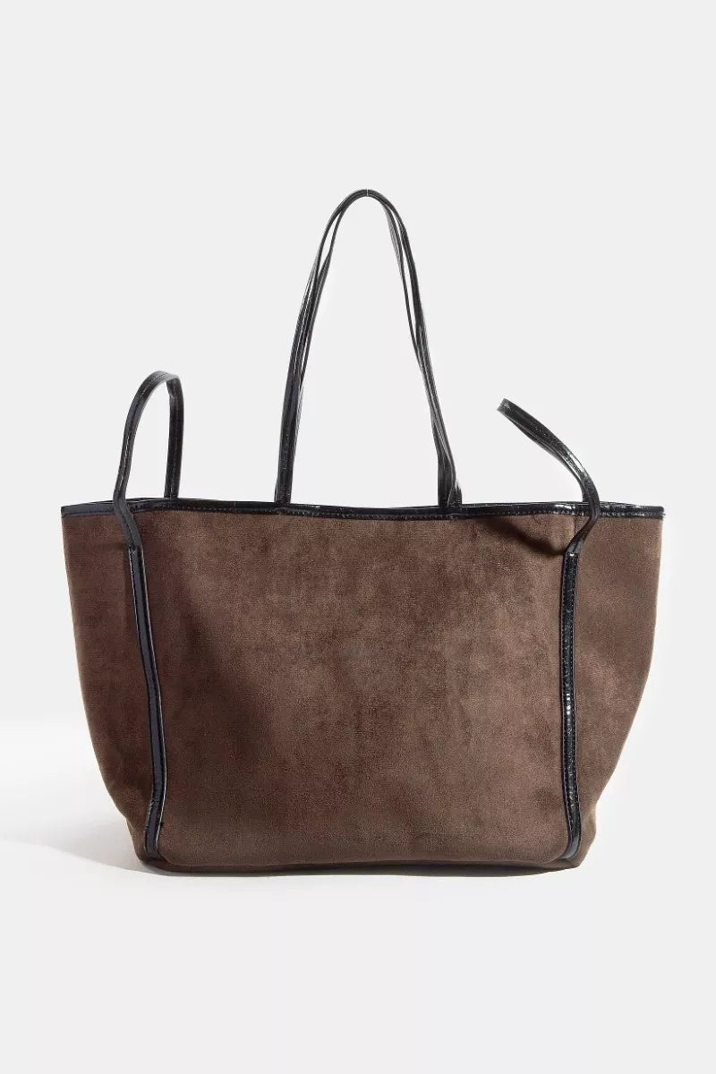 Brown suede tote with black faux-leather trim and top handles, front view.