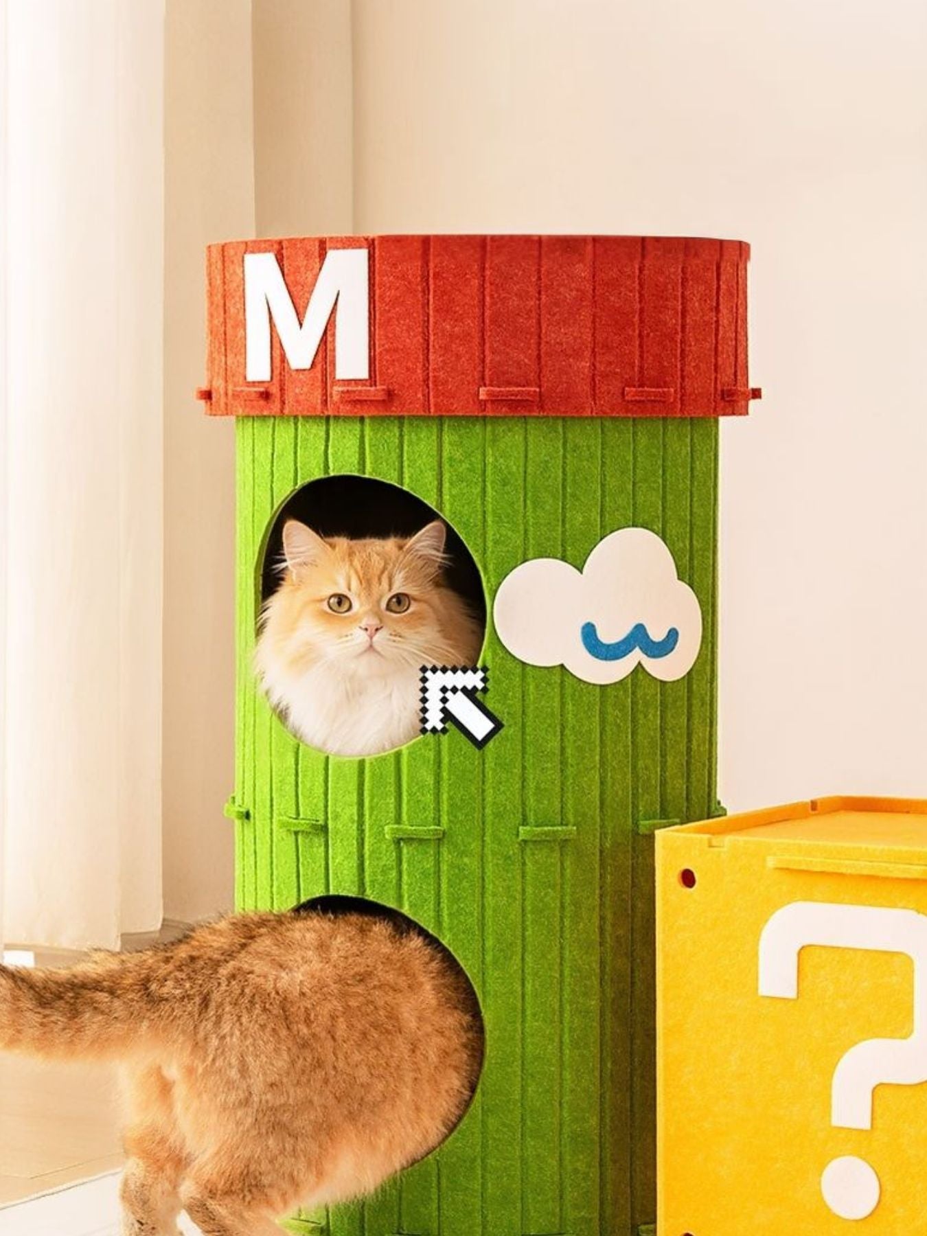 Green cube cat house with M top panel, cat in front opening, cloud graphic