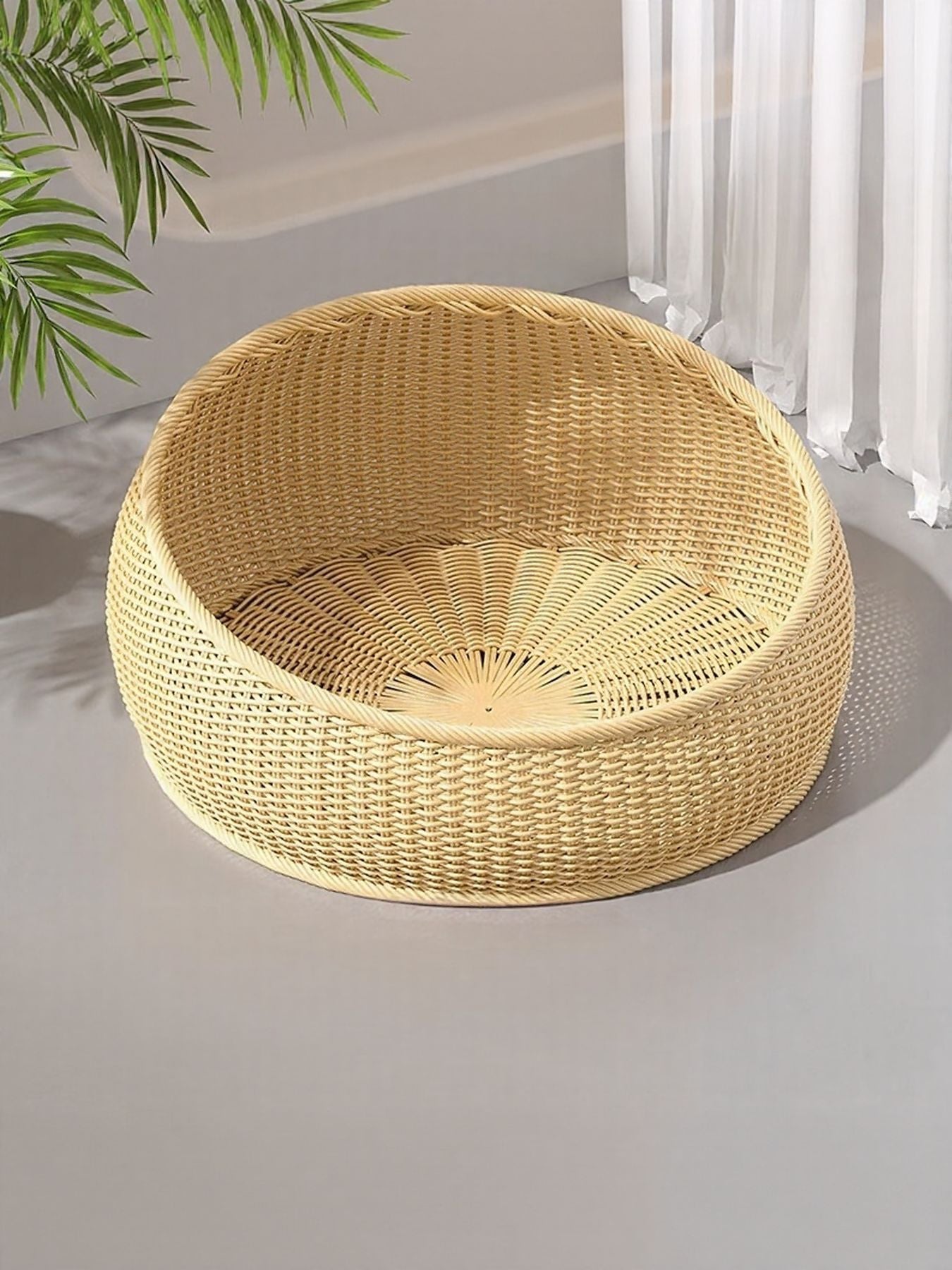 Round woven rattan pet nest in beige with woven cushion base