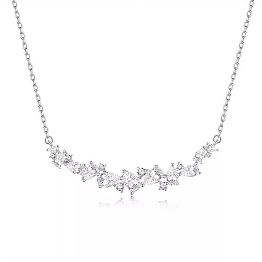 Silver zircon necklace, full front view of linked sparkling stones along the chain