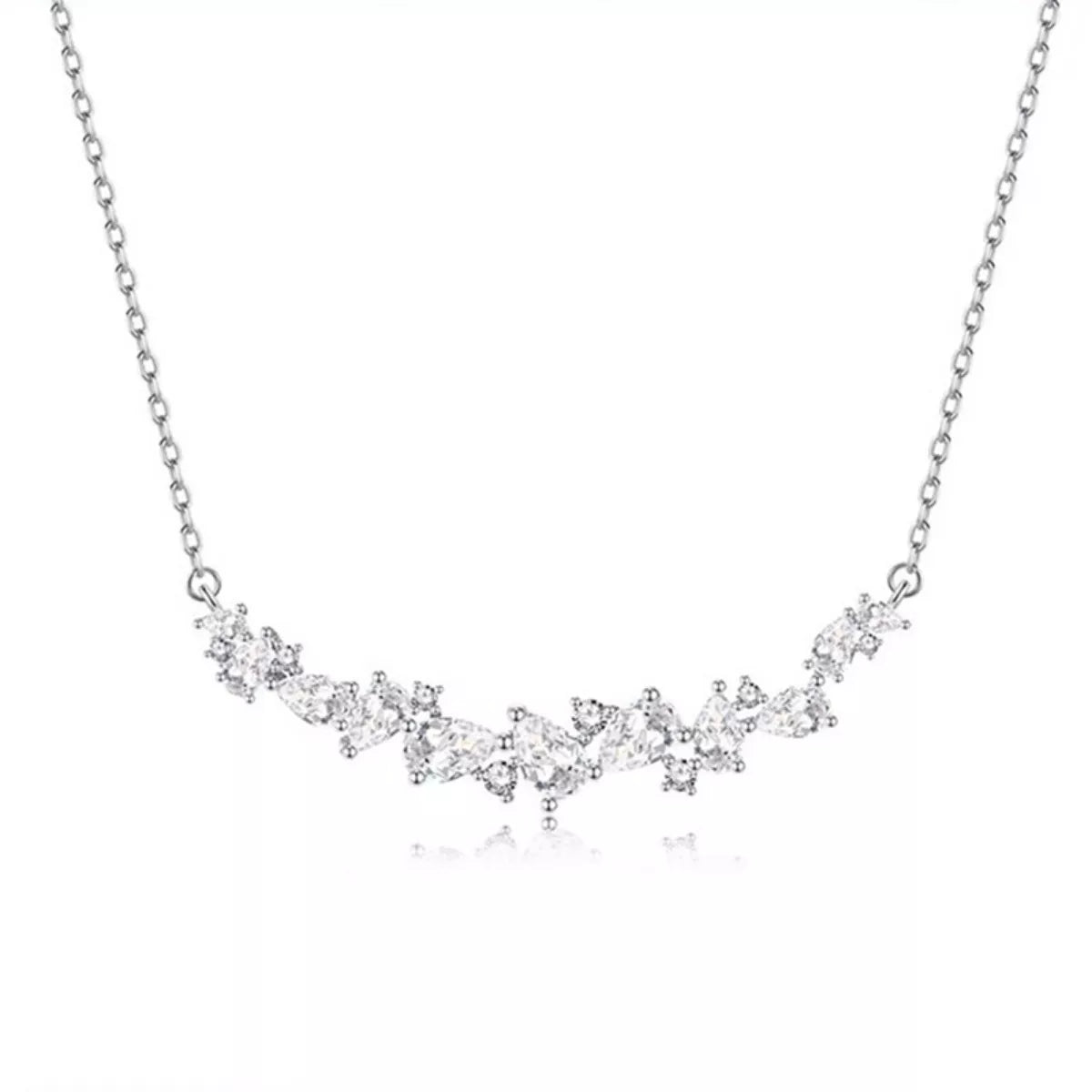 Silver zircon necklace, full front view of linked sparkling stones along the chain
