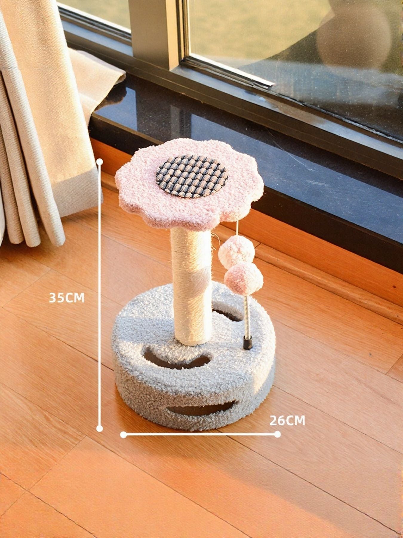 Cat scratching post with dangling balls in powder pink and light blue, plush round scratching pads