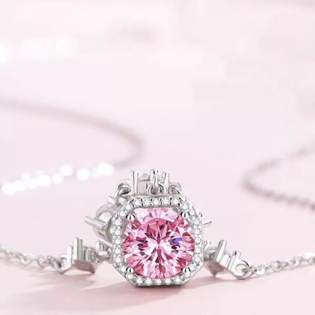 Blush pink zircon pendant with round halo of clear stones on 925 sterling silver chain