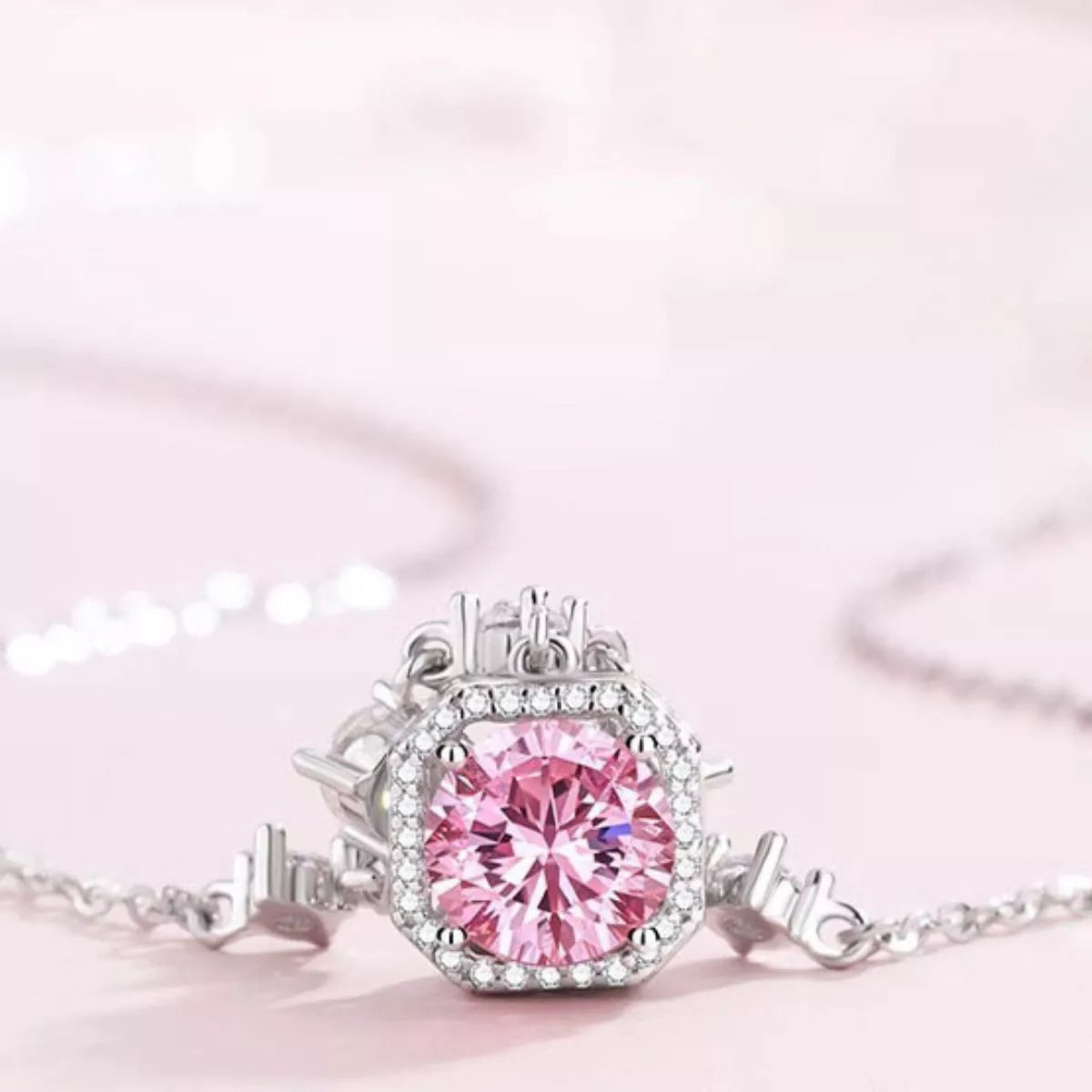 Blush pink zircon pendant with round halo of clear stones on 925 sterling silver chain