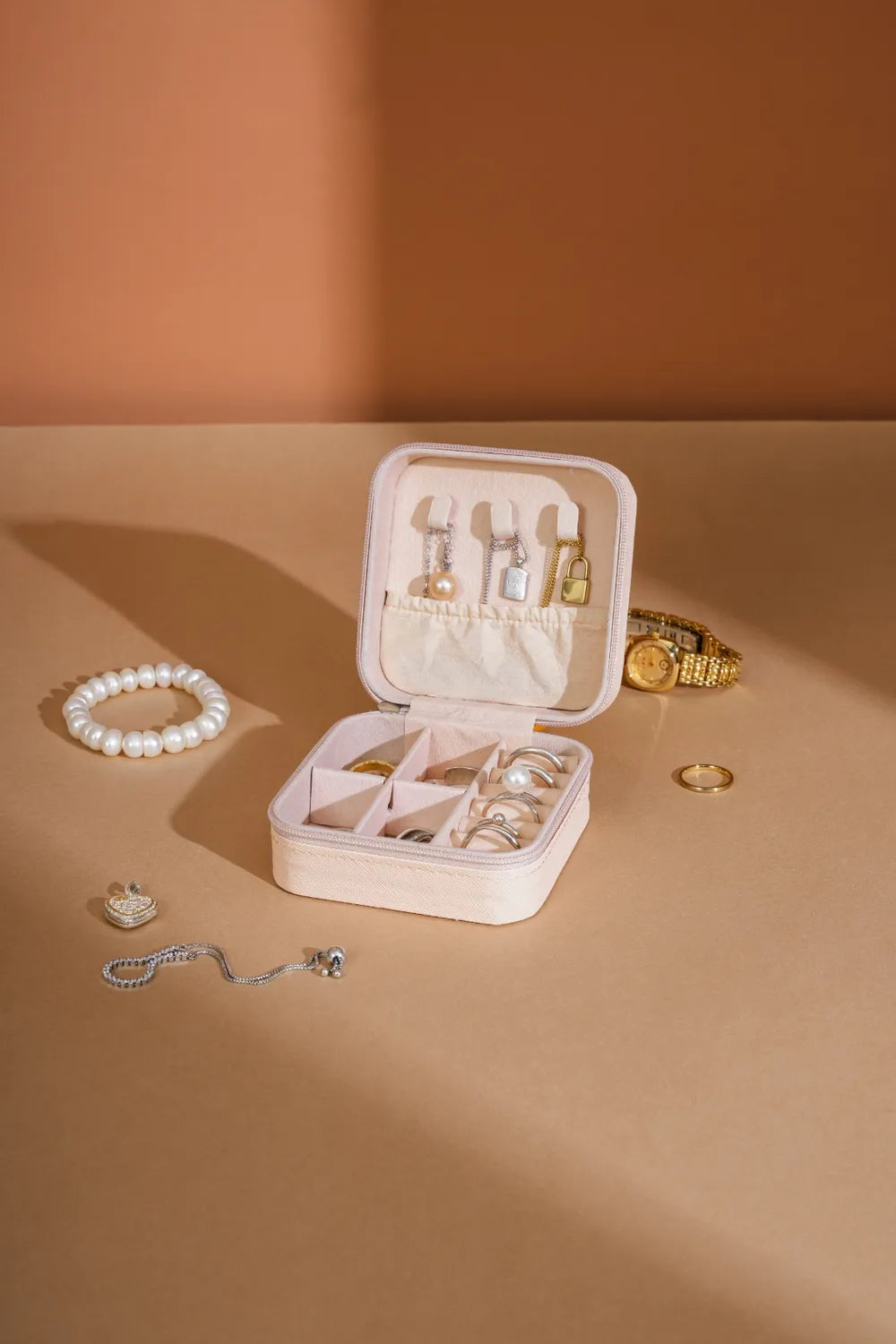 White PU leather square jewelry box, open with ring and earring compartments