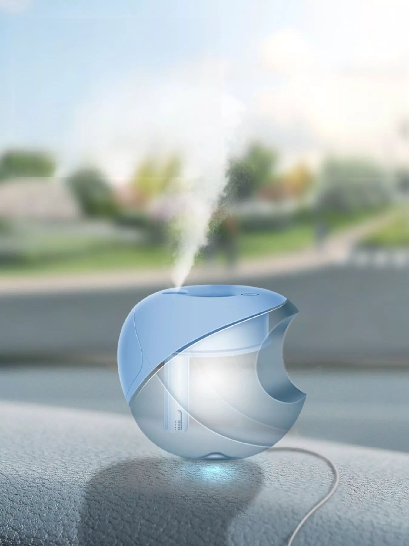 Light blue apple-shaped humidifier releasing a mist stream